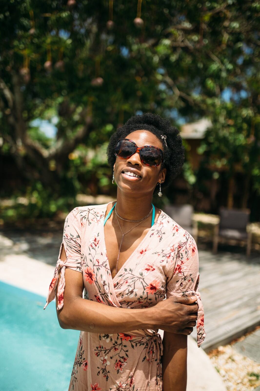 Dee-J by the Pool in Miami portraits story frame 18: Poolside portraits with Dee-J Spaulding in Miami, moving through direct expression, swimwear details, bright water and warm Florida light.