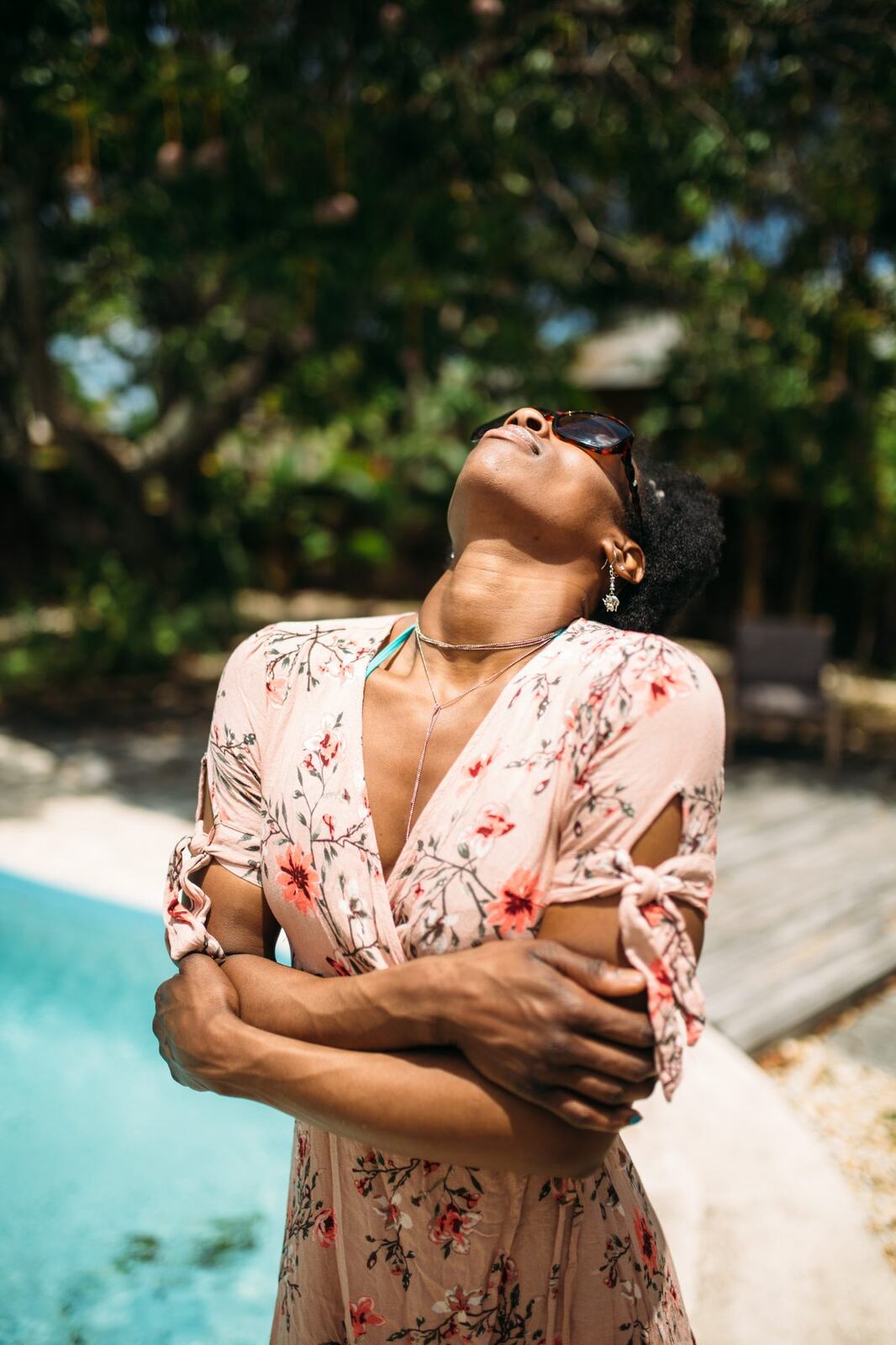 Dee-J by the Pool in Miami portraits story frame 20: Poolside portraits with Dee-J Spaulding in Miami, moving through direct expression, swimwear details, bright water and warm Florida light.