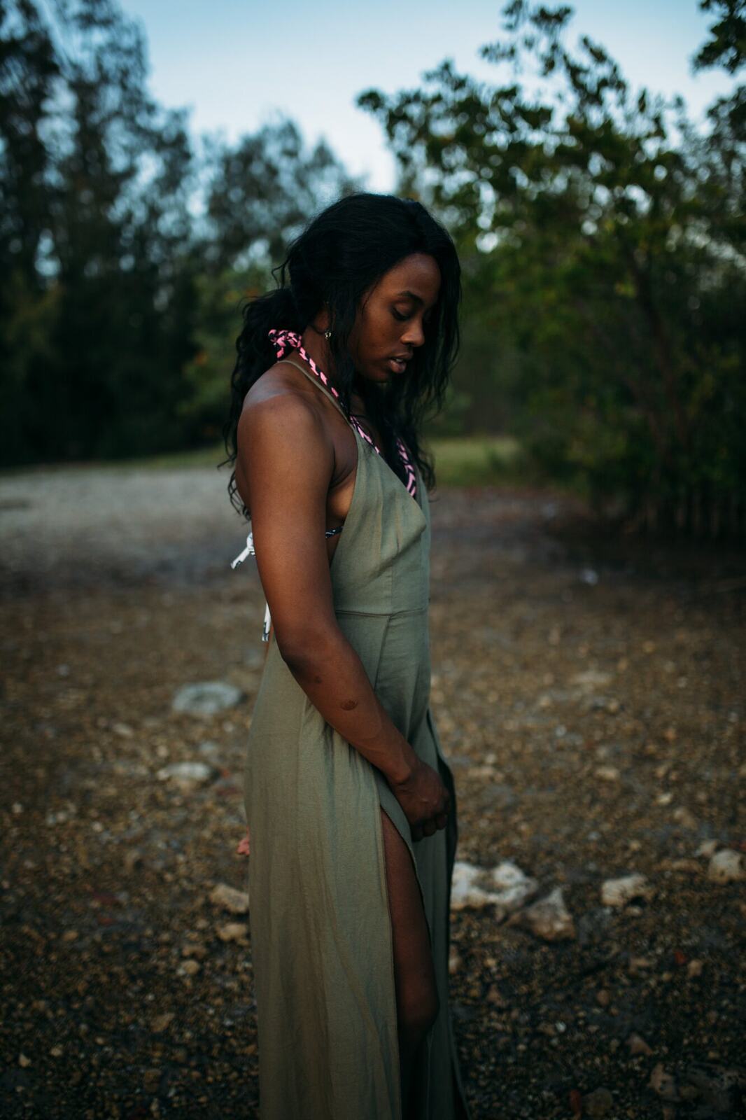 Dee-J in Miami portraits story frame 30: Two days with Dee-J in Miami, moving from a bright poolside portrait story to a second pool sequence and green-dress portraits along the riverbank.