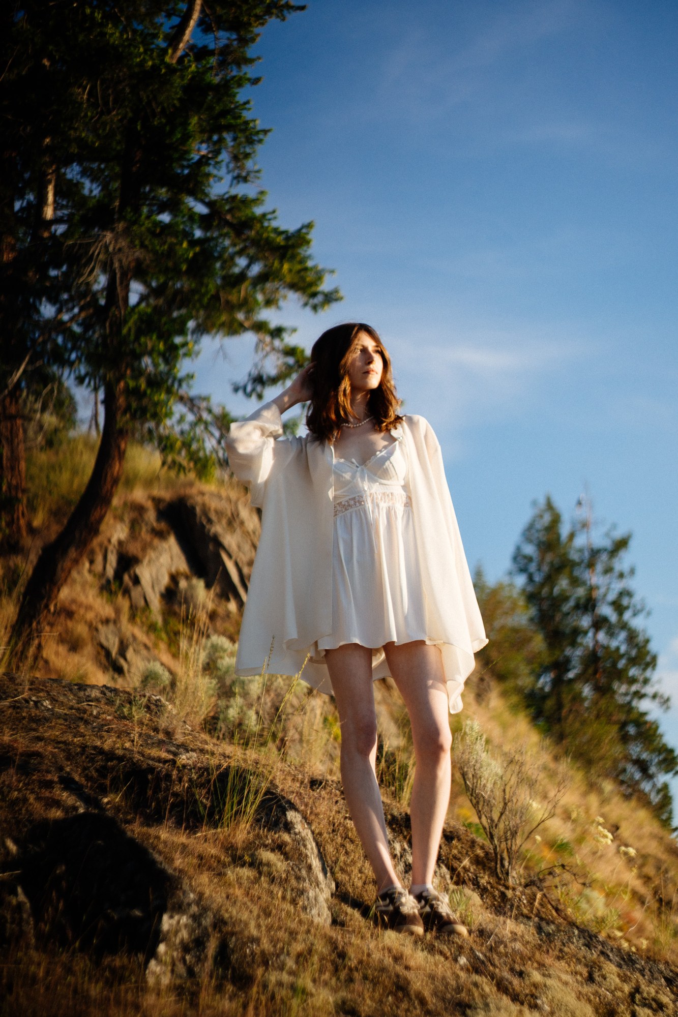 Destiny at Paul’s Tomb: Full white dress against the blue lake.