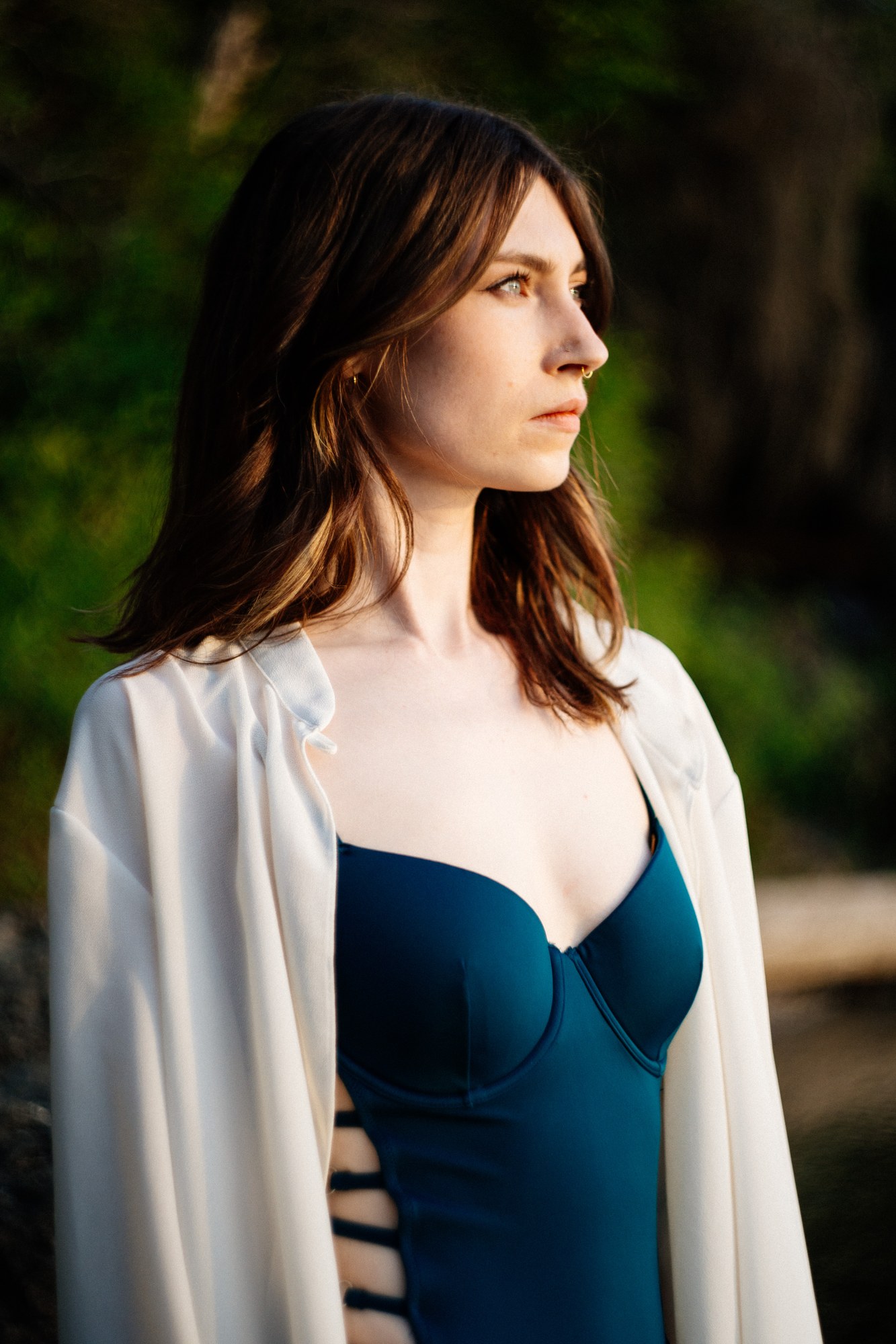 Destiny at Paul’s Tomb: Teal swimsuit and white robe in profile.