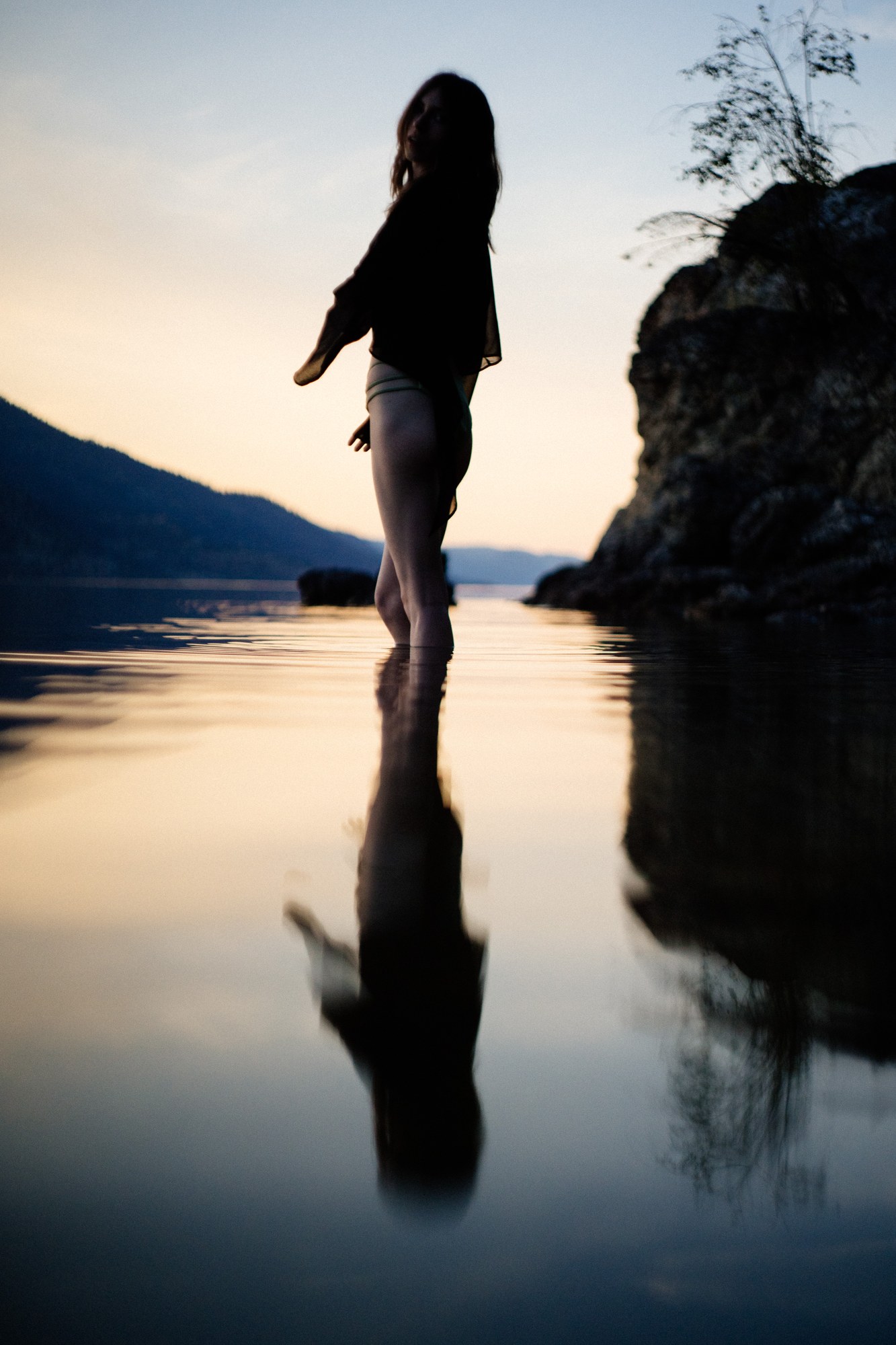 Destiny at Paul’s Tomb: Long reflected silhouette walking by the lake.