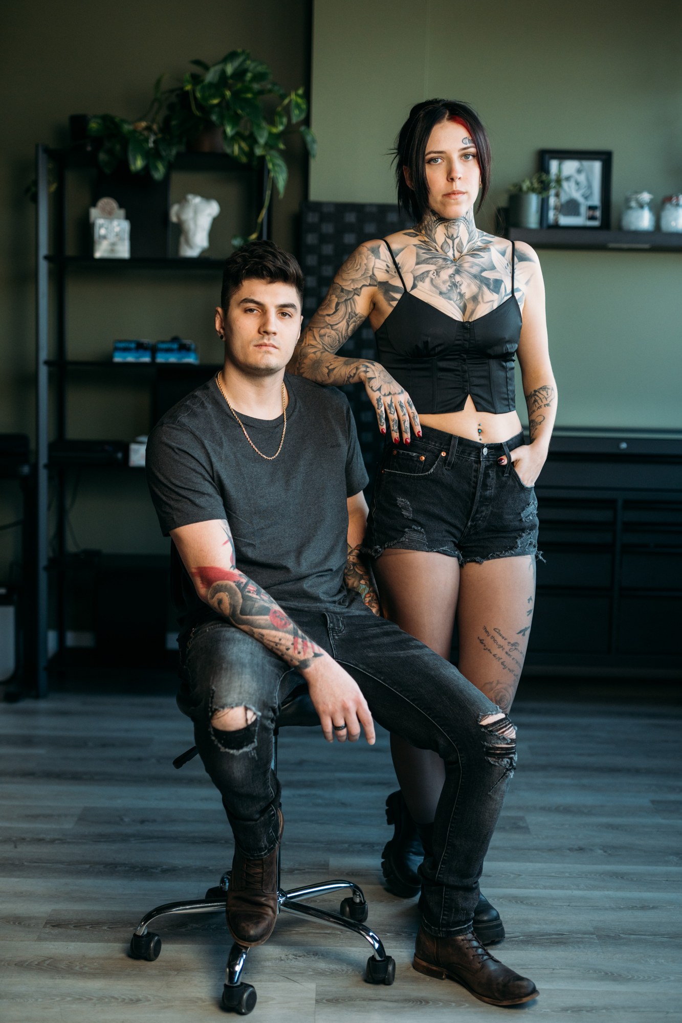 District Ink: Paired seated and standing portrait inside the studio.