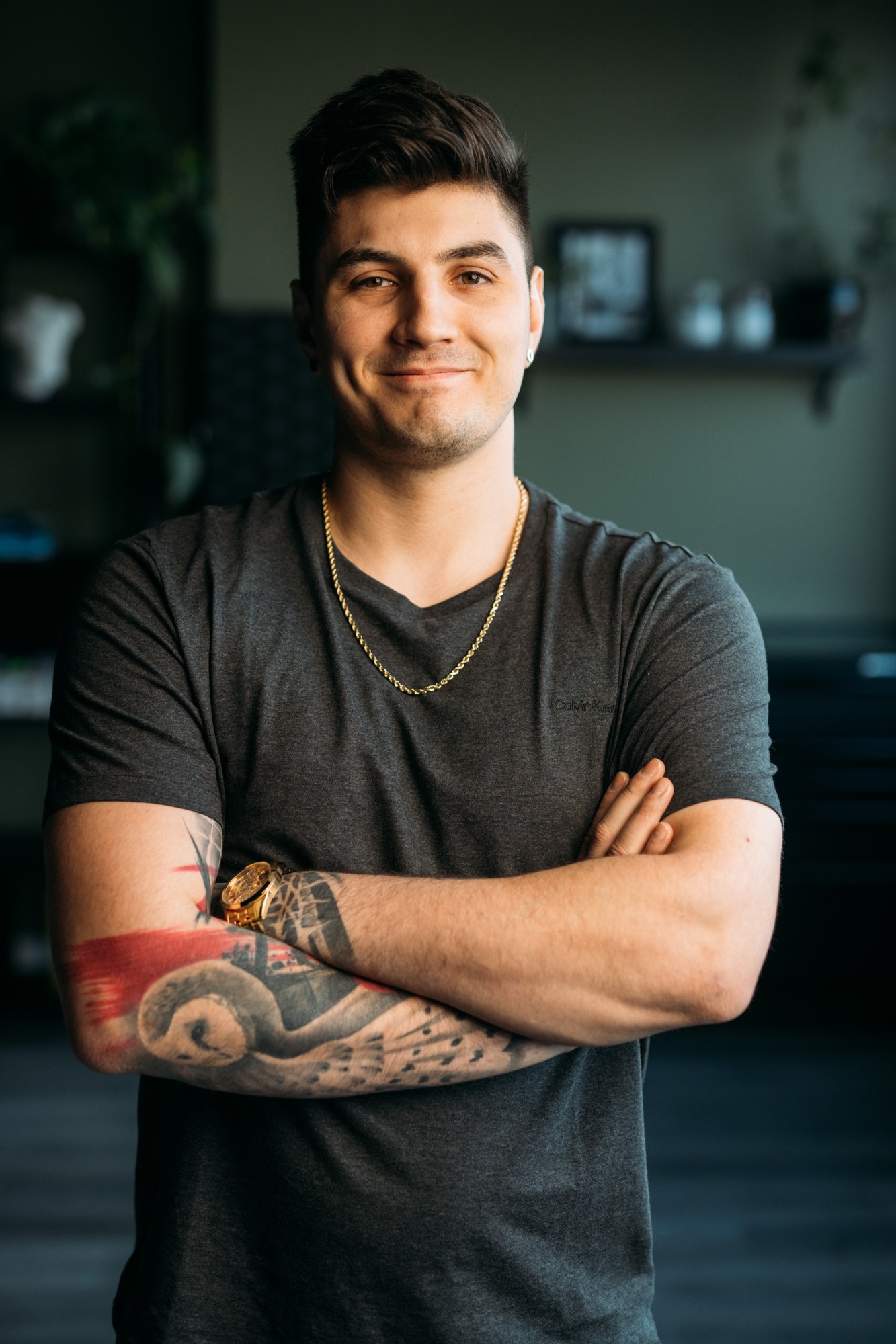 District Ink: Friendly crossed-arm individual portrait.