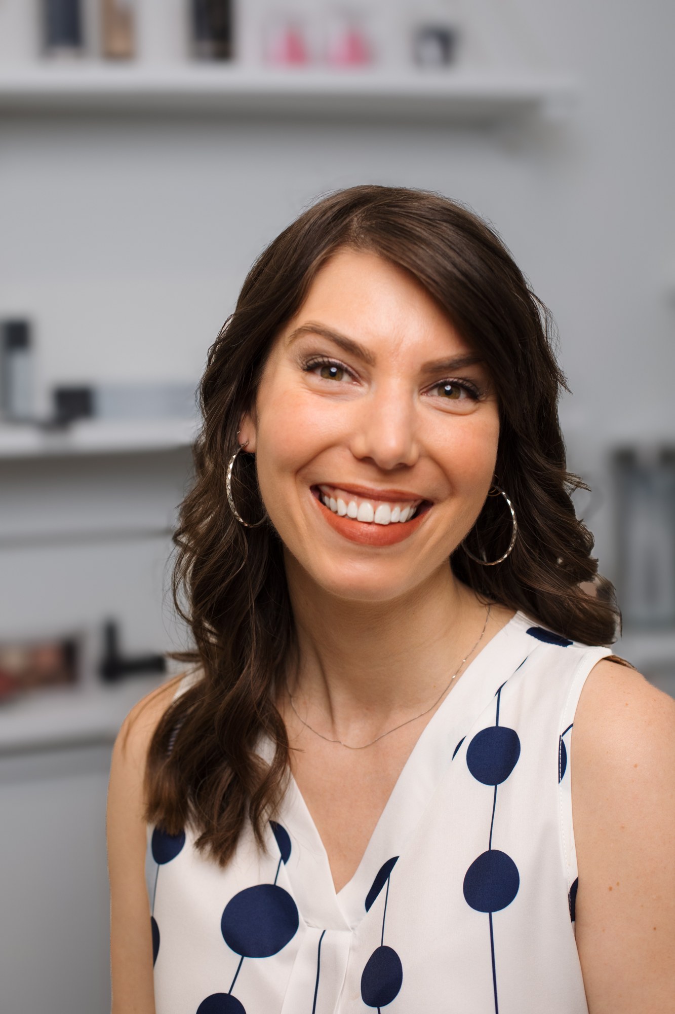 Bridal Beauty at Diva Den: Warm smiling portrait of Lindsay.