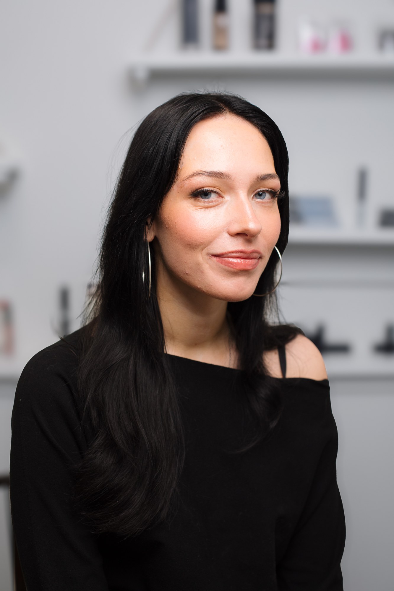 Bridal Beauty at Diva Den: Quiet finished portrait with sleek dark hair.