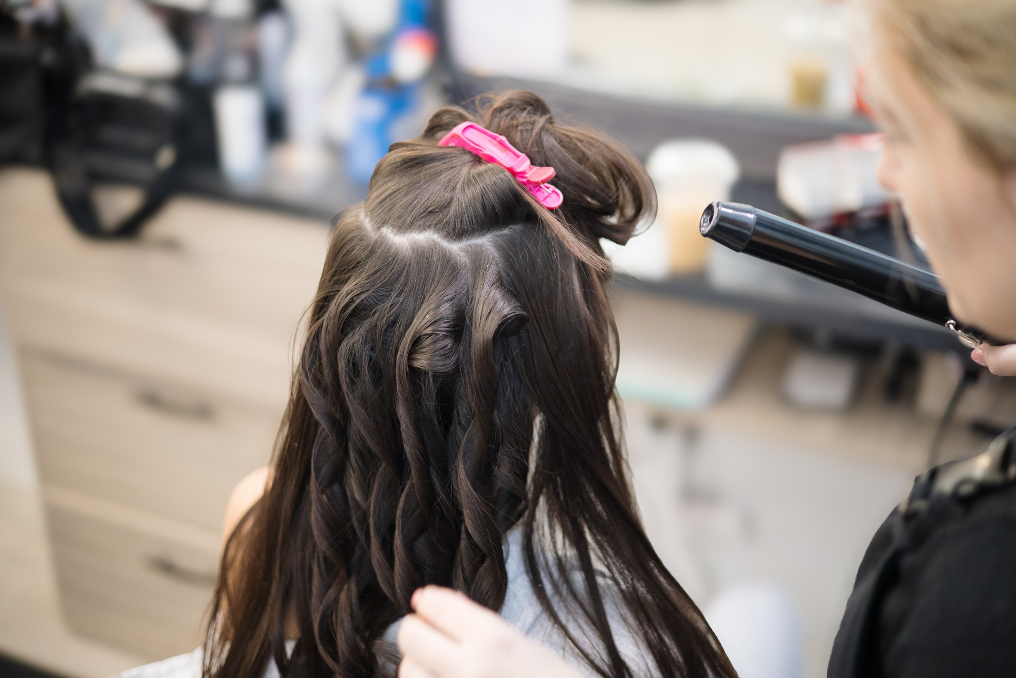 Bridal Beauty at Diva Den: Hair being sectioned and styled.