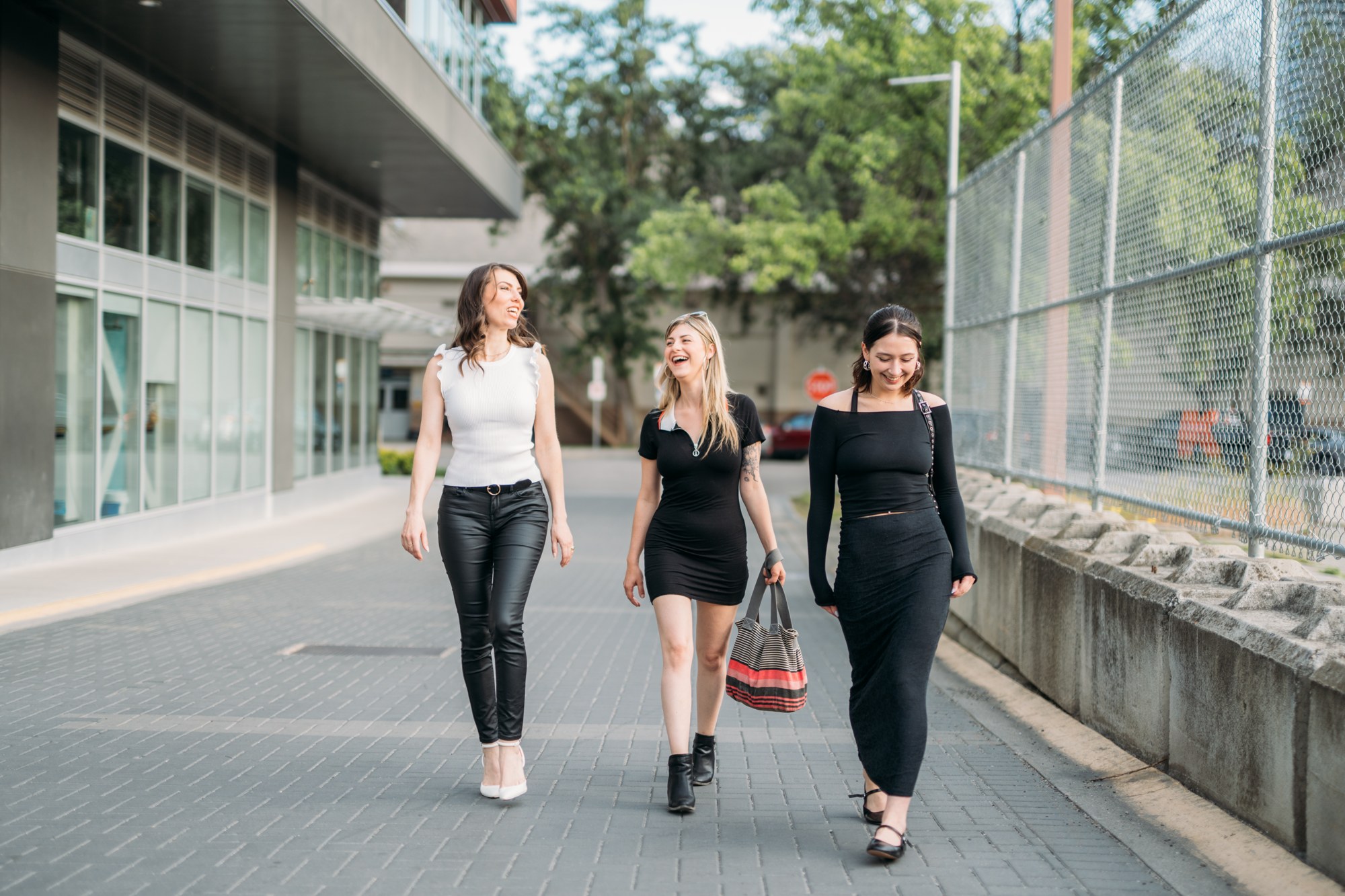 Diva Den Team Portraits: The three team members walking together.