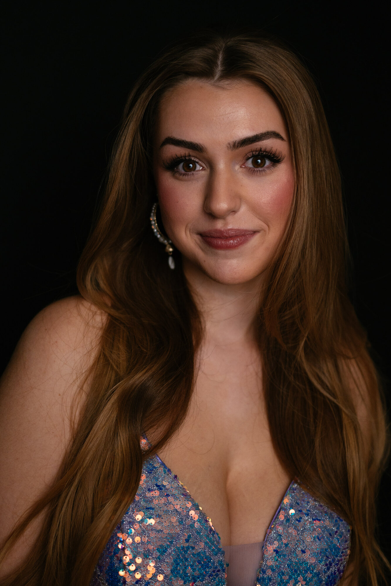 Elena close black-backdrop headshot