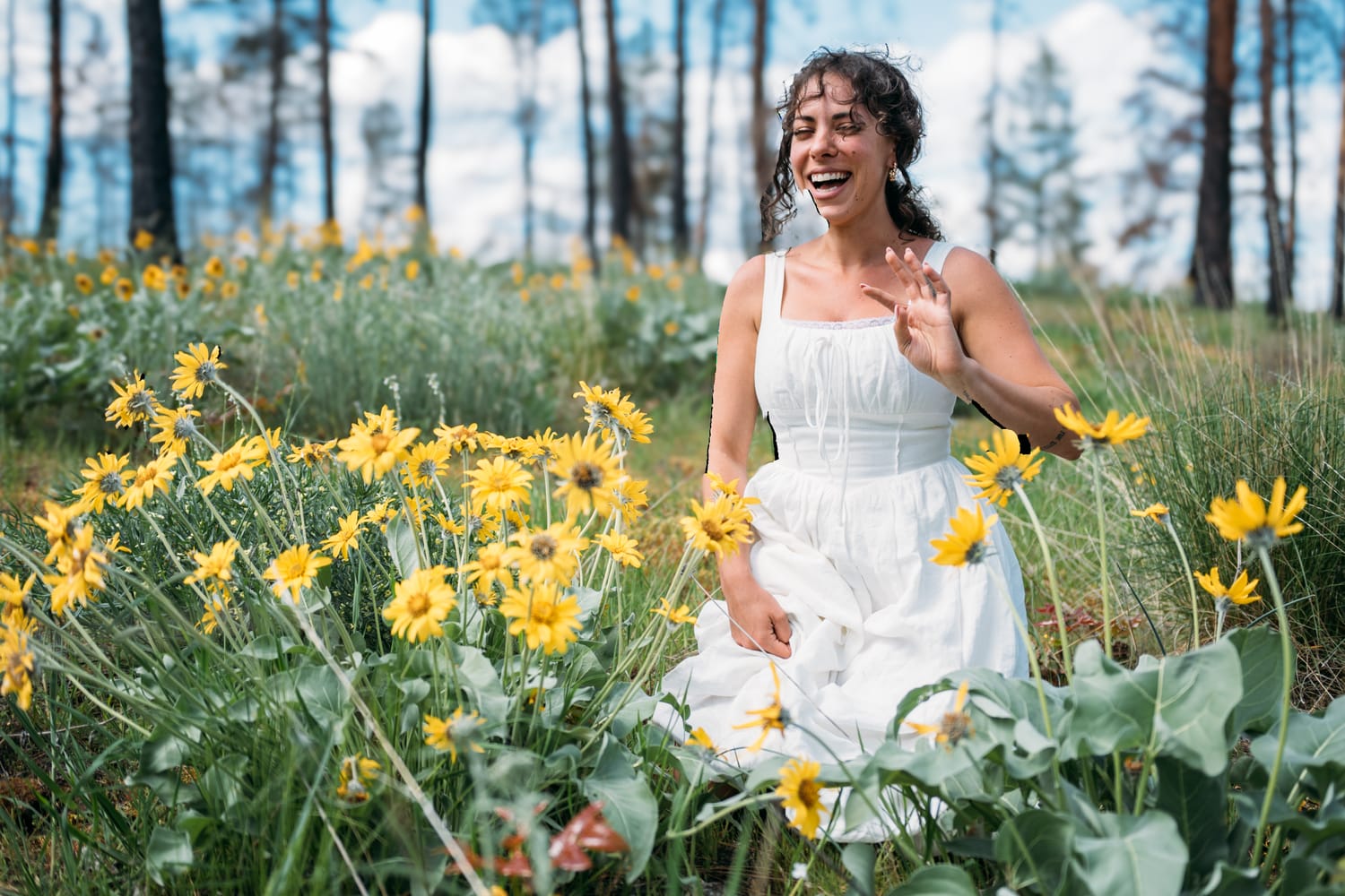 Giuliana at LoveReins portraits story frame 3: Equestrian portrait session at Love Reins Ranch in Lake Country, BC, with Giuliana, horses, white-dress portraits, Western cowgirl styling, ranch fencing, riding frames and warm Okanagan light..