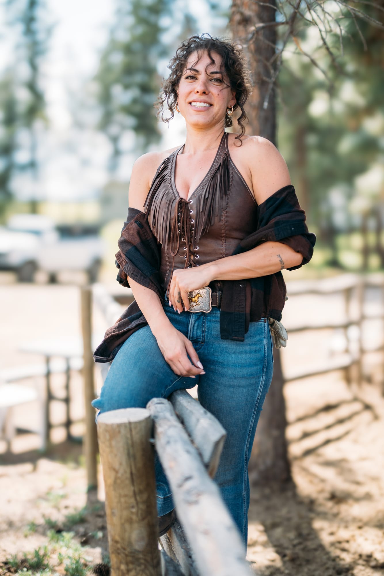 Giuliana at LoveReins portraits story frame 7: Equestrian portrait session at Love Reins Ranch in Lake Country, BC, with Giuliana, horses, white-dress portraits, Western cowgirl styling, ranch fencing, riding frames and warm Okanagan light..