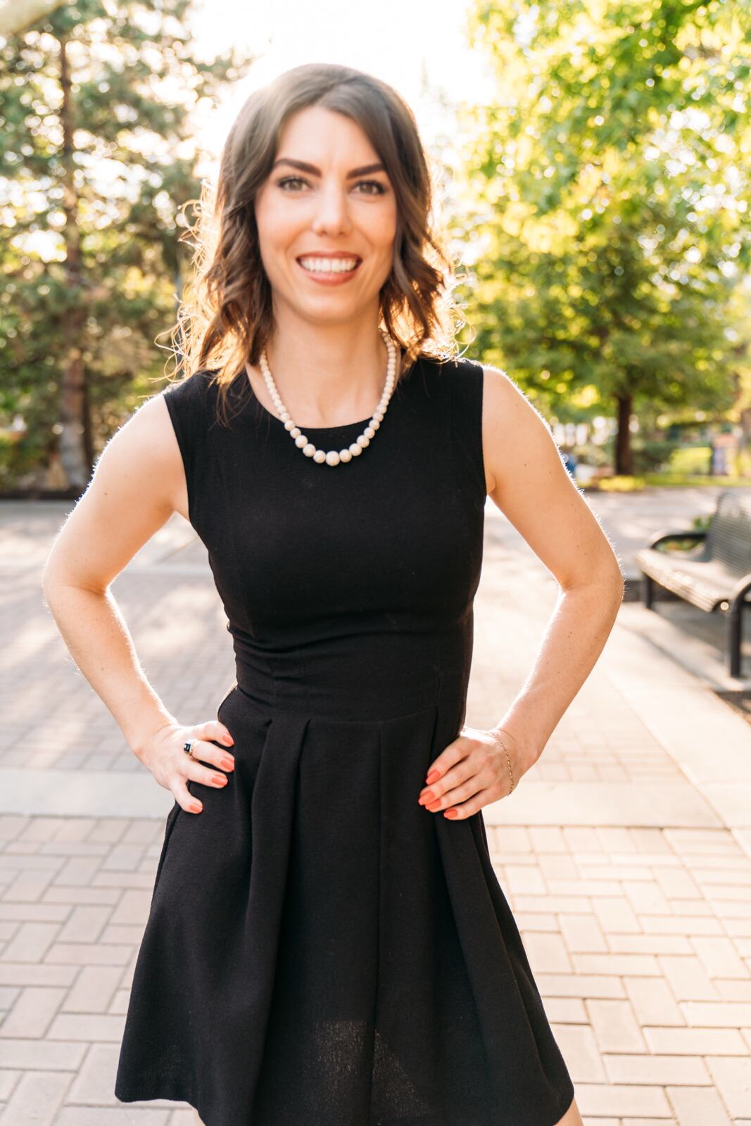 Lindsay standing outdoors in warm city light
