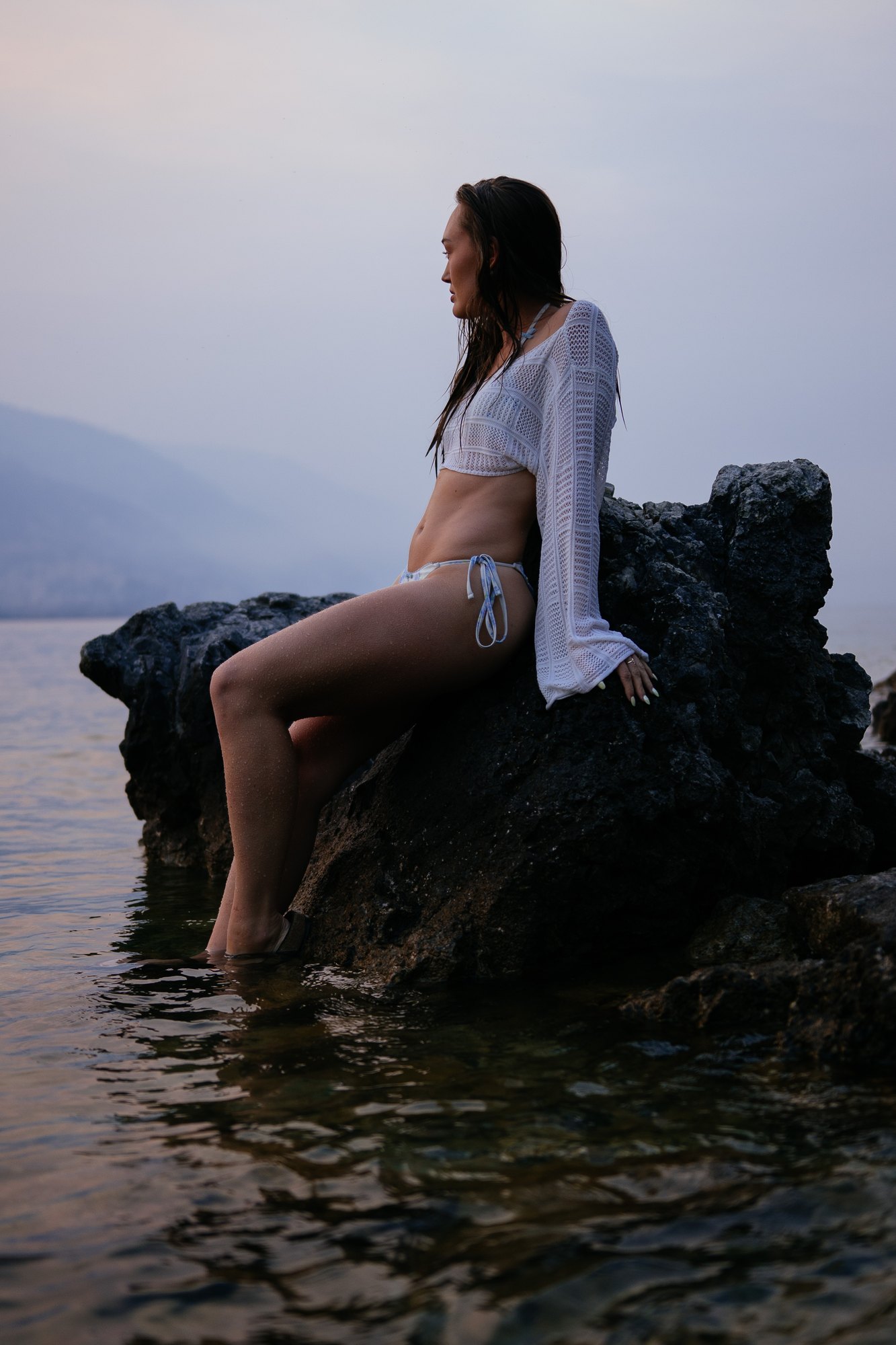 Holly — seated profile on a rock in the lake