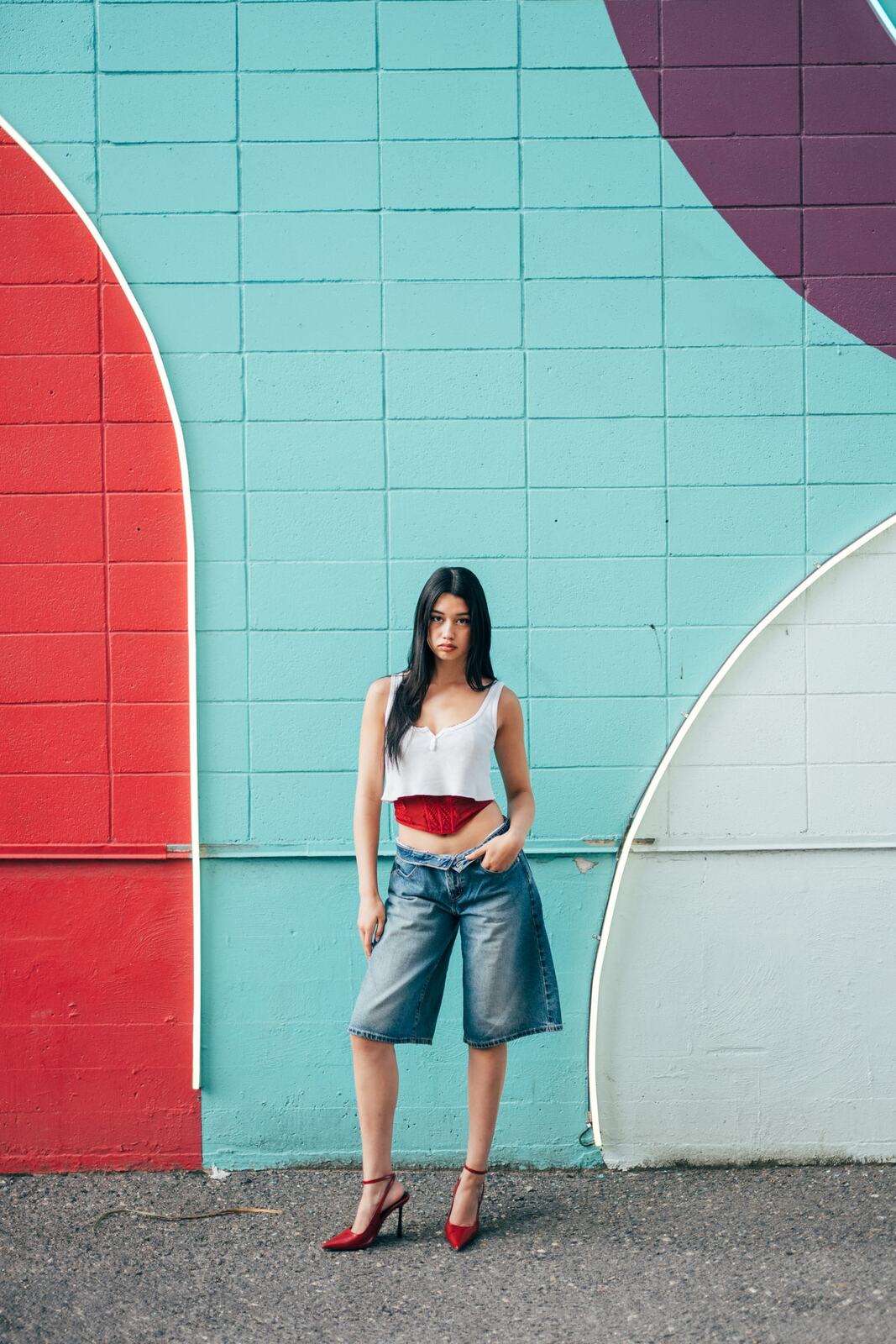 Julia in Kamloops portraits story frame 1: Colour walls, graffiti, black brick, red brick and a city walk with enough range to feel like a little editorial day.