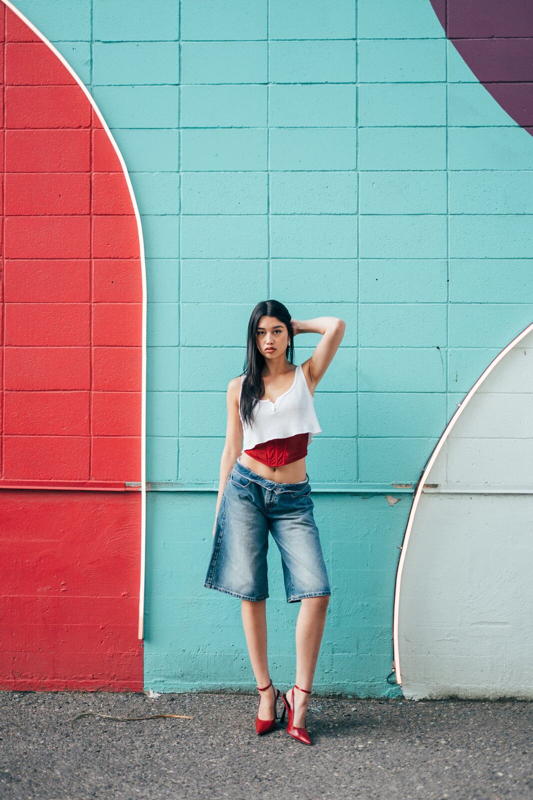 Julia in Kamloops portraits story frame 2: Colour walls, graffiti, black brick, red brick and a city walk with enough range to feel like a little editorial day.