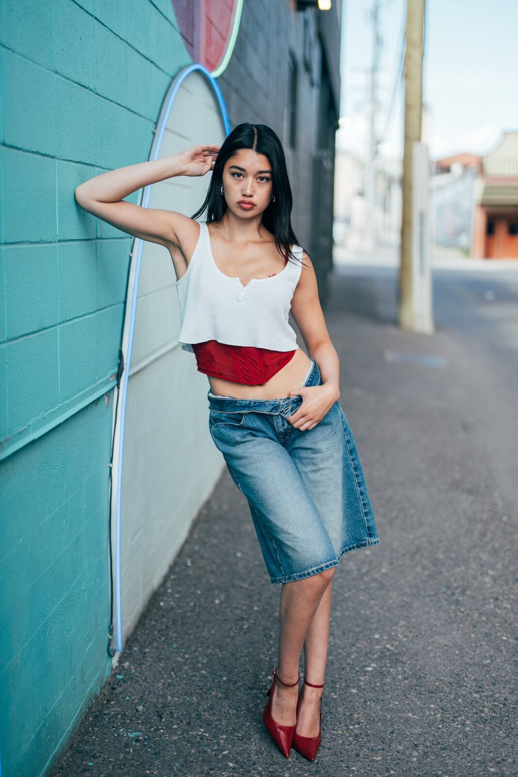 Julia in Kamloops portraits story frame 7: Colour walls, graffiti, black brick, red brick and a city walk with enough range to feel like a little editorial day.