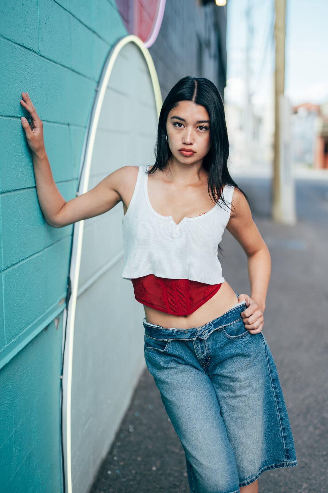 Julia in Kamloops portraits story frame 8: Colour walls, graffiti, black brick, red brick and a city walk with enough range to feel like a little editorial day.