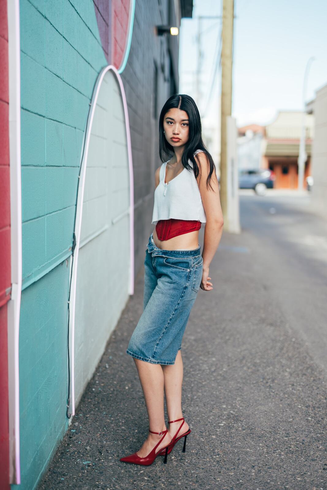 Julia in Kamloops portraits story frame 9: Colour walls, graffiti, black brick, red brick and a city walk with enough range to feel like a little editorial day.