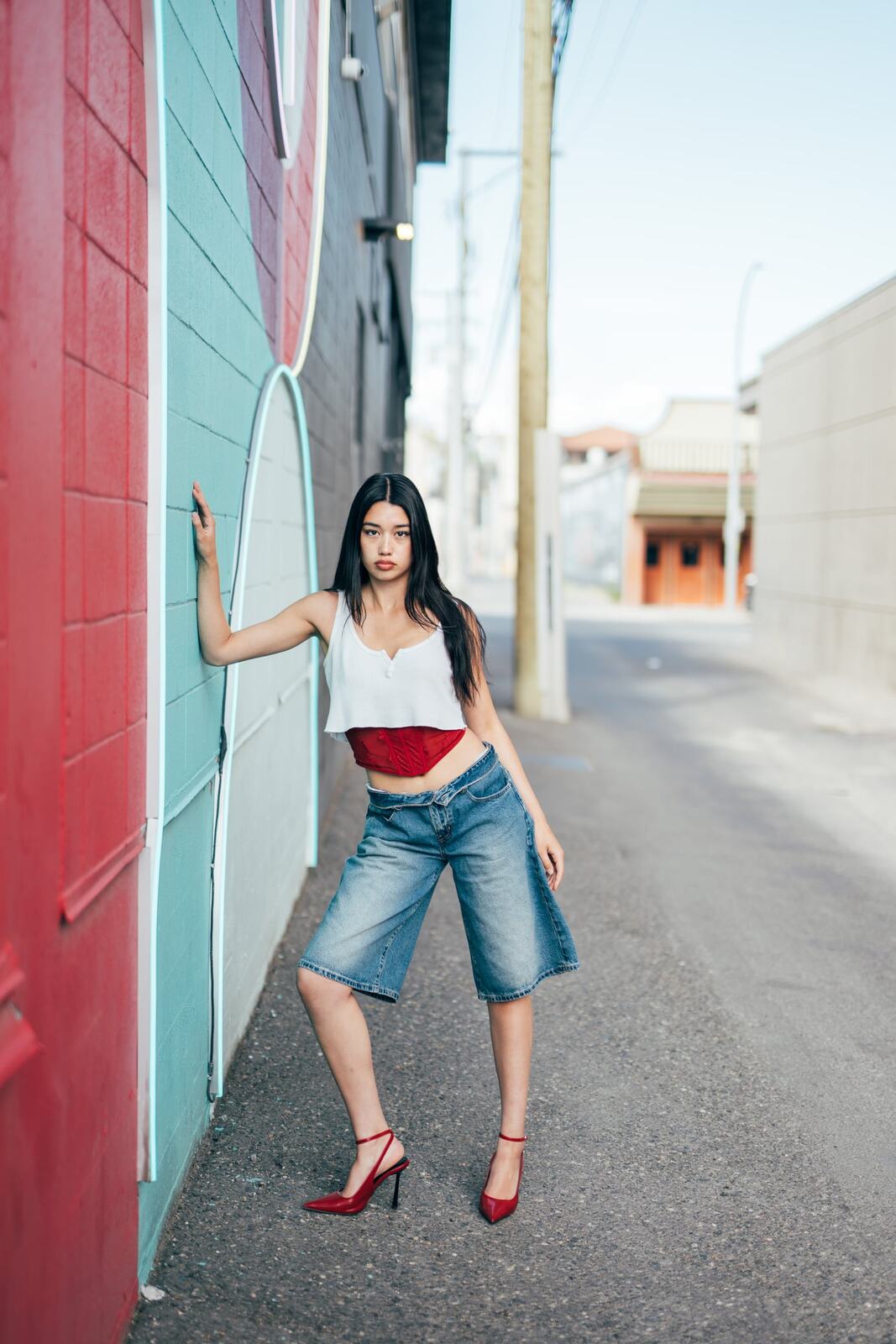 Julia in Kamloops portraits story frame 10: Colour walls, graffiti, black brick, red brick and a city walk with enough range to feel like a little editorial day.