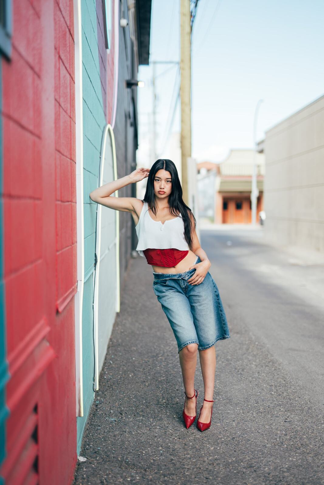 Julia in Kamloops portraits story frame 11: Colour walls, graffiti, black brick, red brick and a city walk with enough range to feel like a little editorial day.