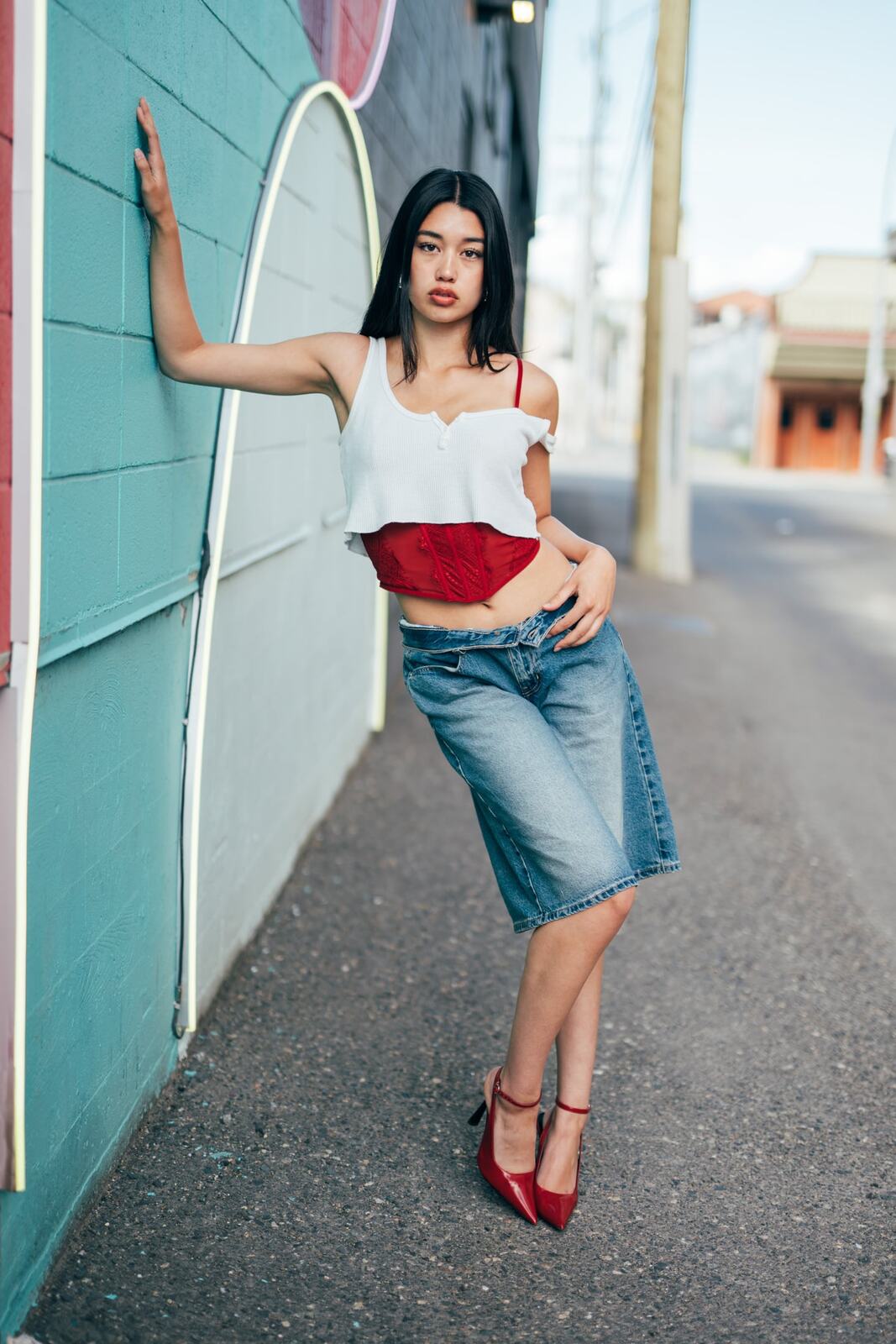 Julia in Kamloops portraits story frame 14: Colour walls, graffiti, black brick, red brick and a city walk with enough range to feel like a little editorial day.