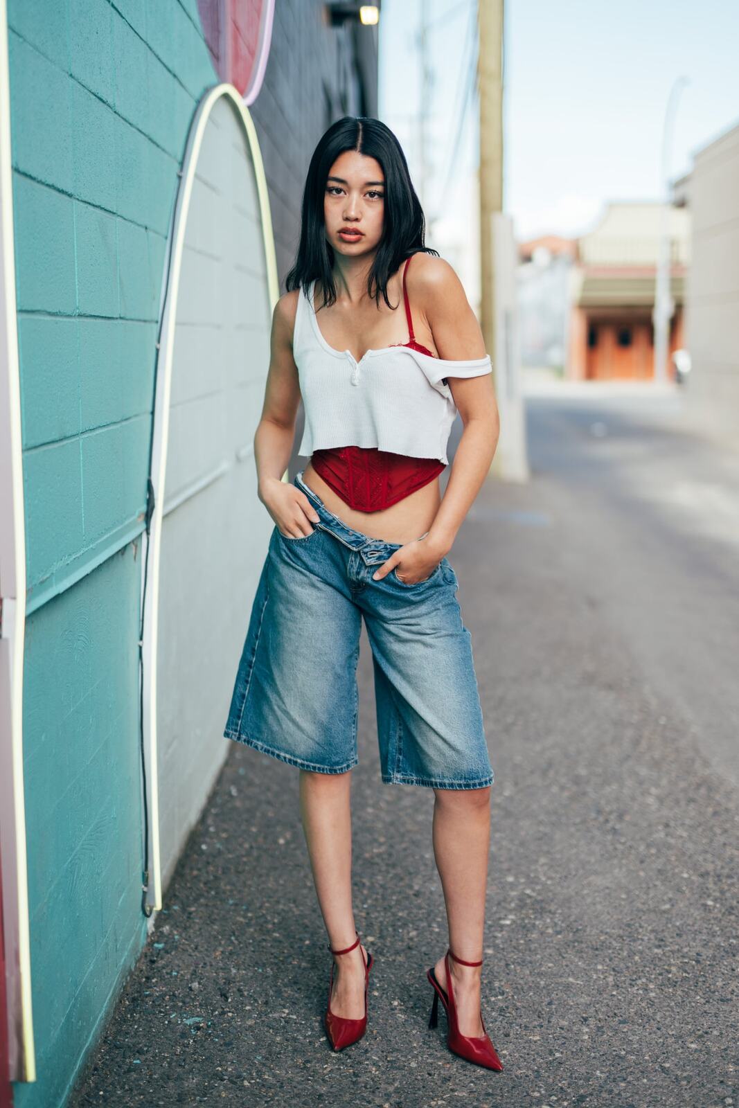 Julia in Kamloops portraits story frame 17: Colour walls, graffiti, black brick, red brick and a city walk with enough range to feel like a little editorial day.