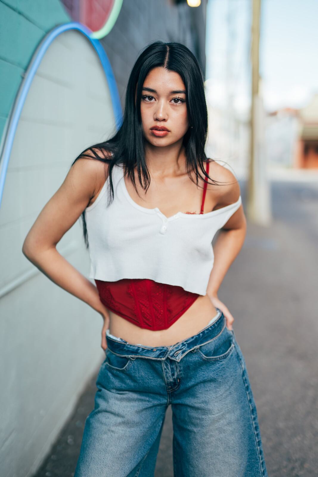 Julia in Kamloops portraits story frame 20: Colour walls, graffiti, black brick, red brick and a city walk with enough range to feel like a little editorial day.