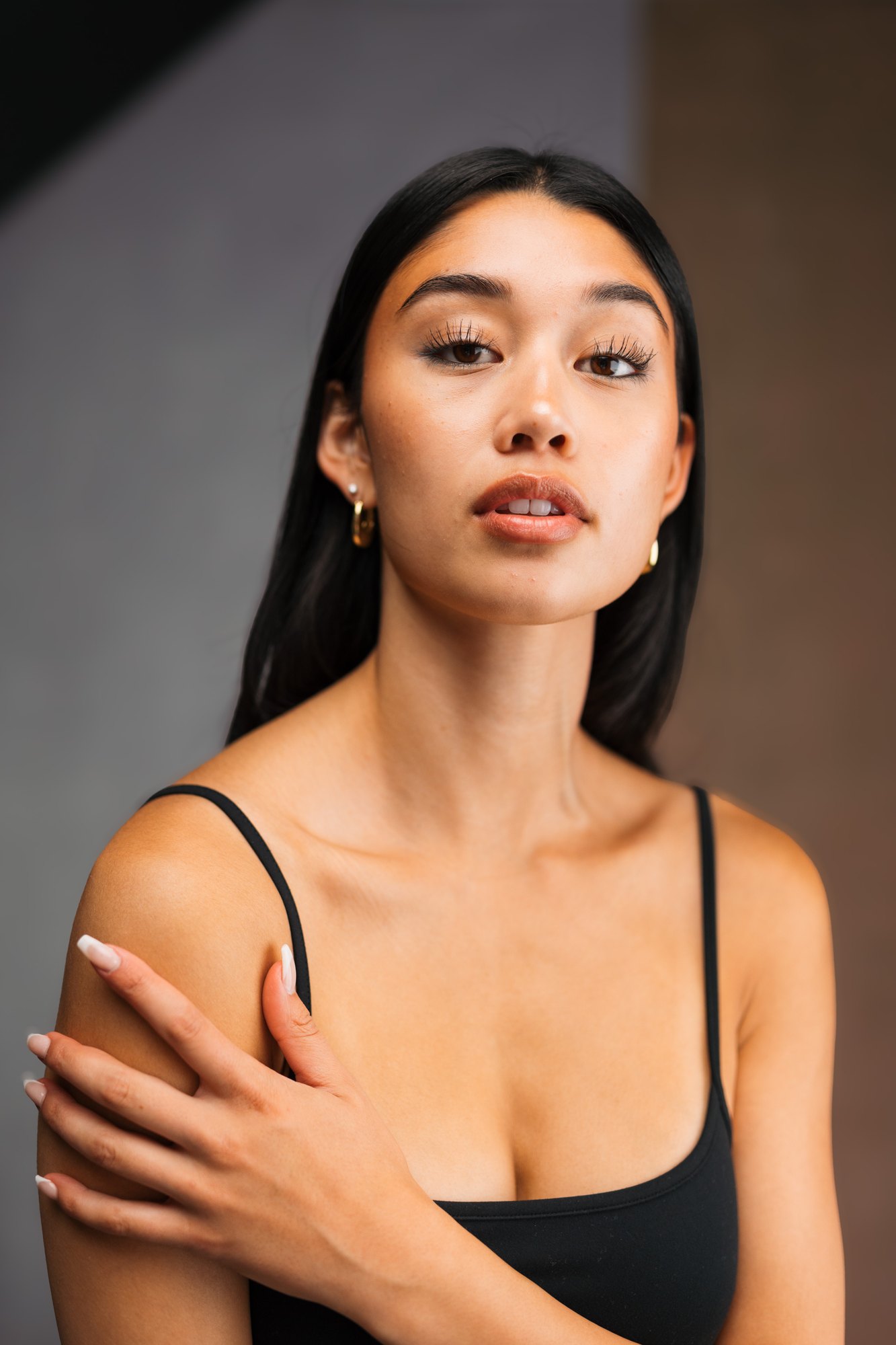 Julia Crofoot — close portrait with a raised chin and hand on her shoulder