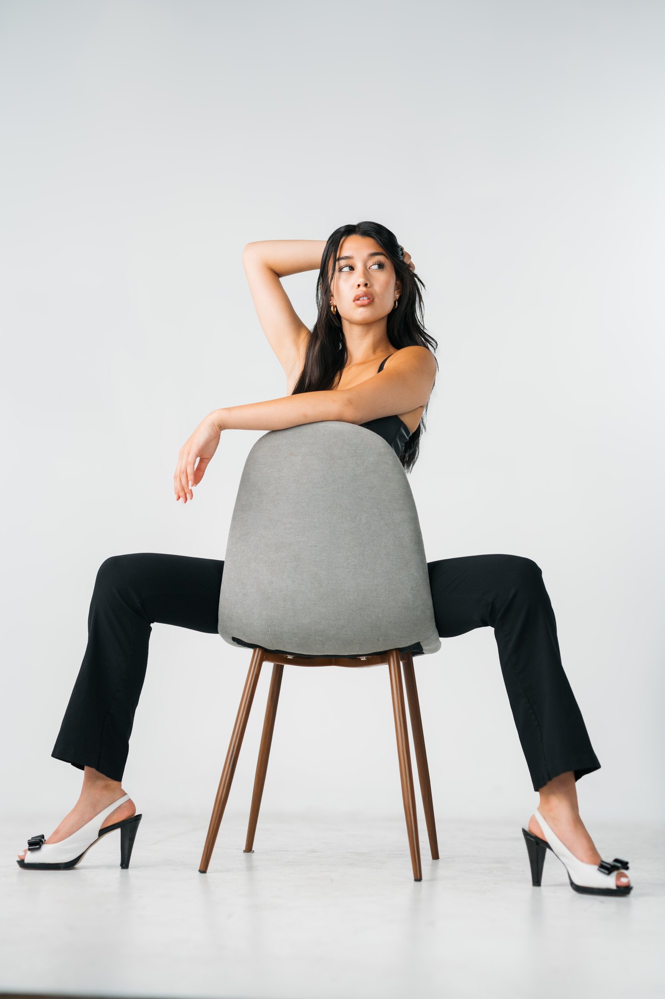 Julia Crofoot — sitting backwards on a grey chair
