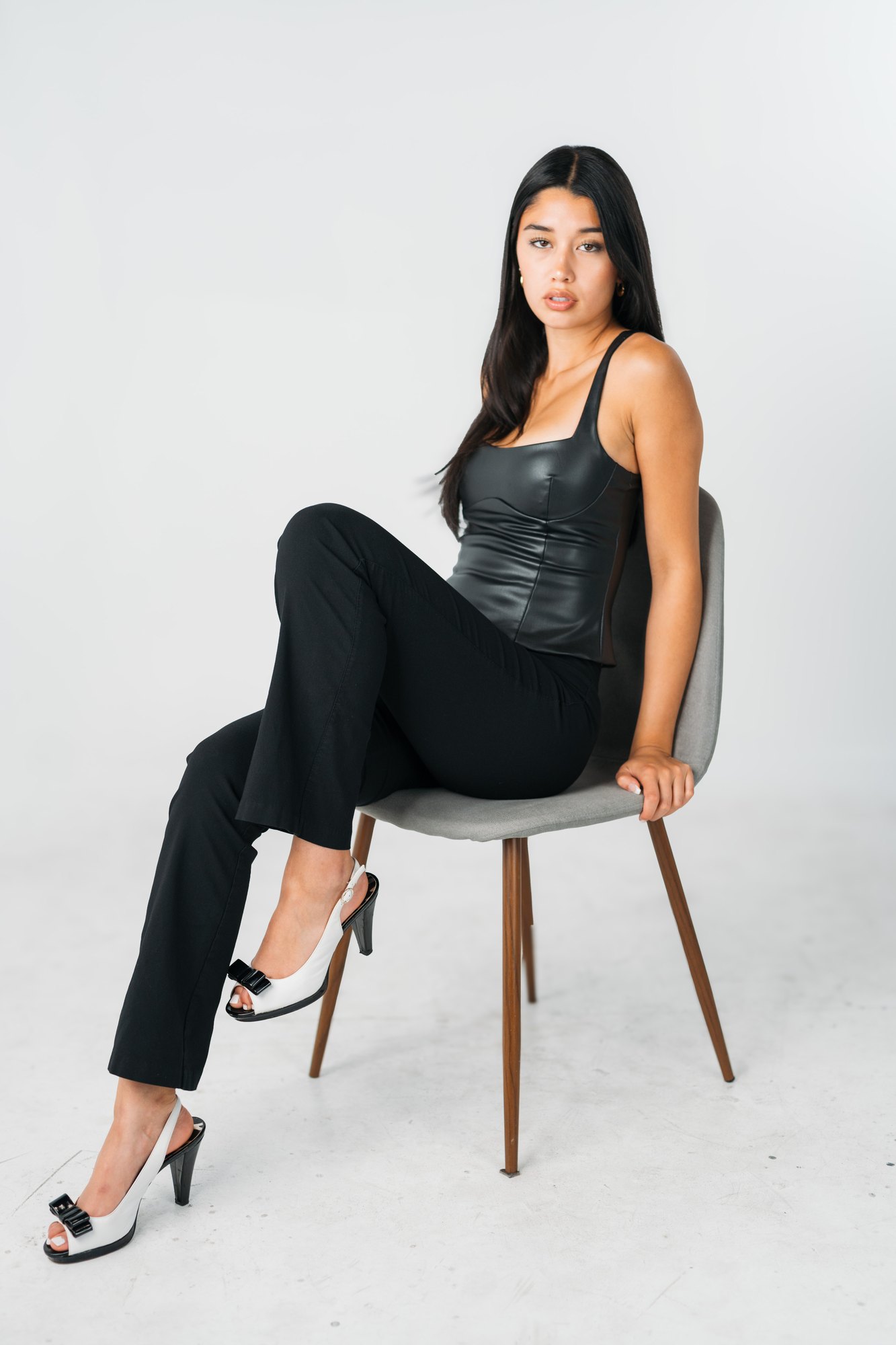 Julia Crofoot — full-length seated portrait in black