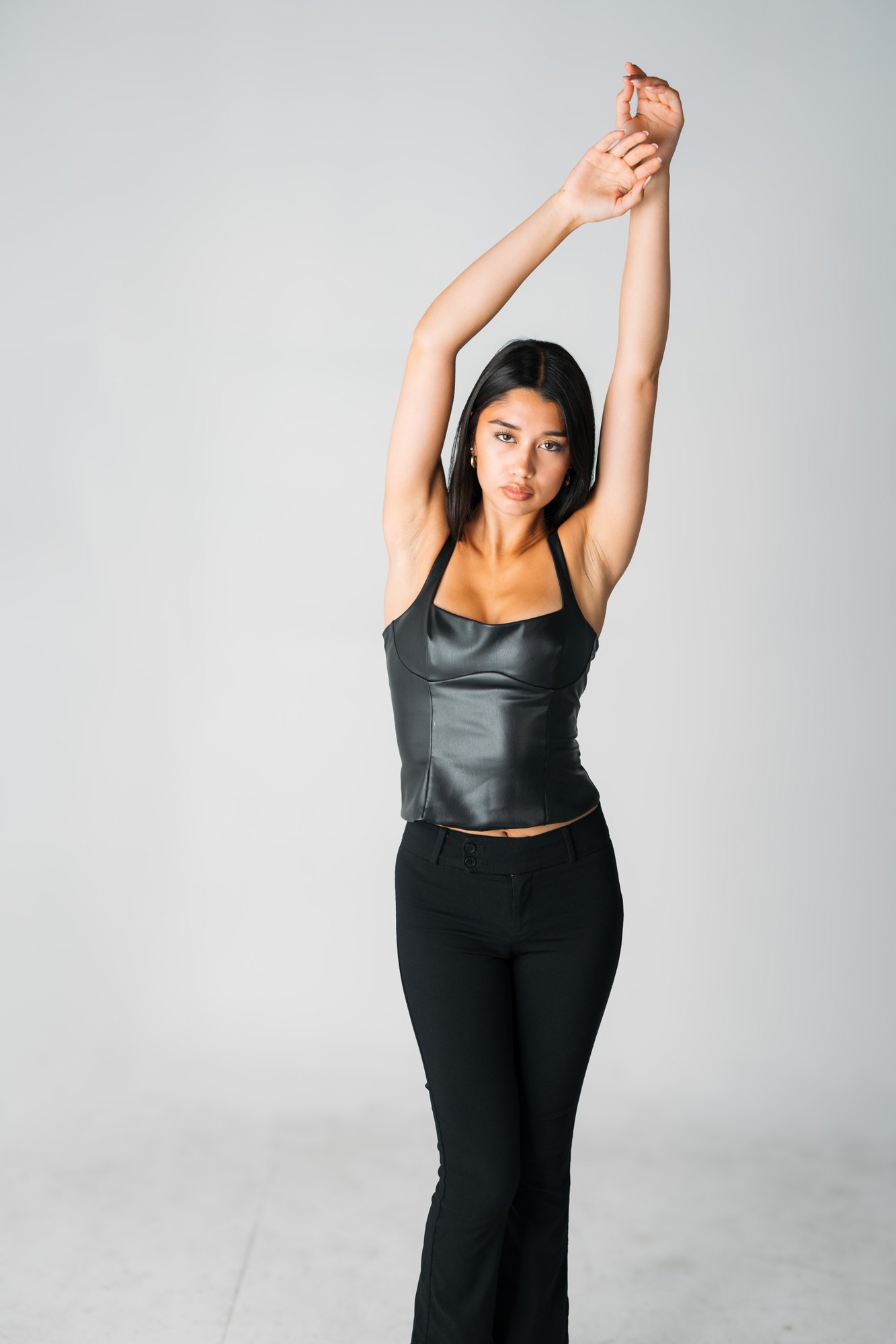 Julia Crofoot — standing with both arms extended overhead
