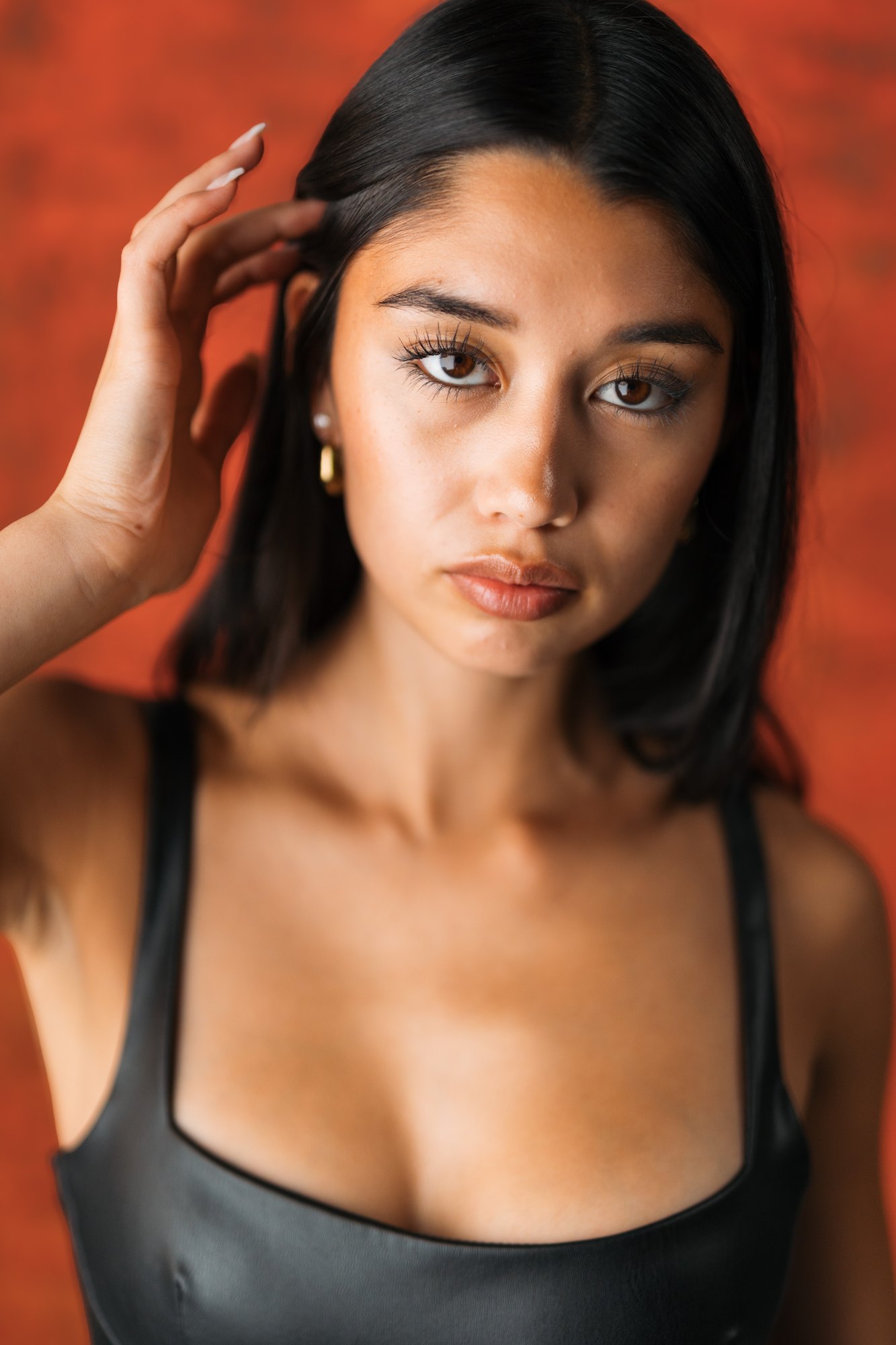 Julia Crofoot — close portrait against the red panel