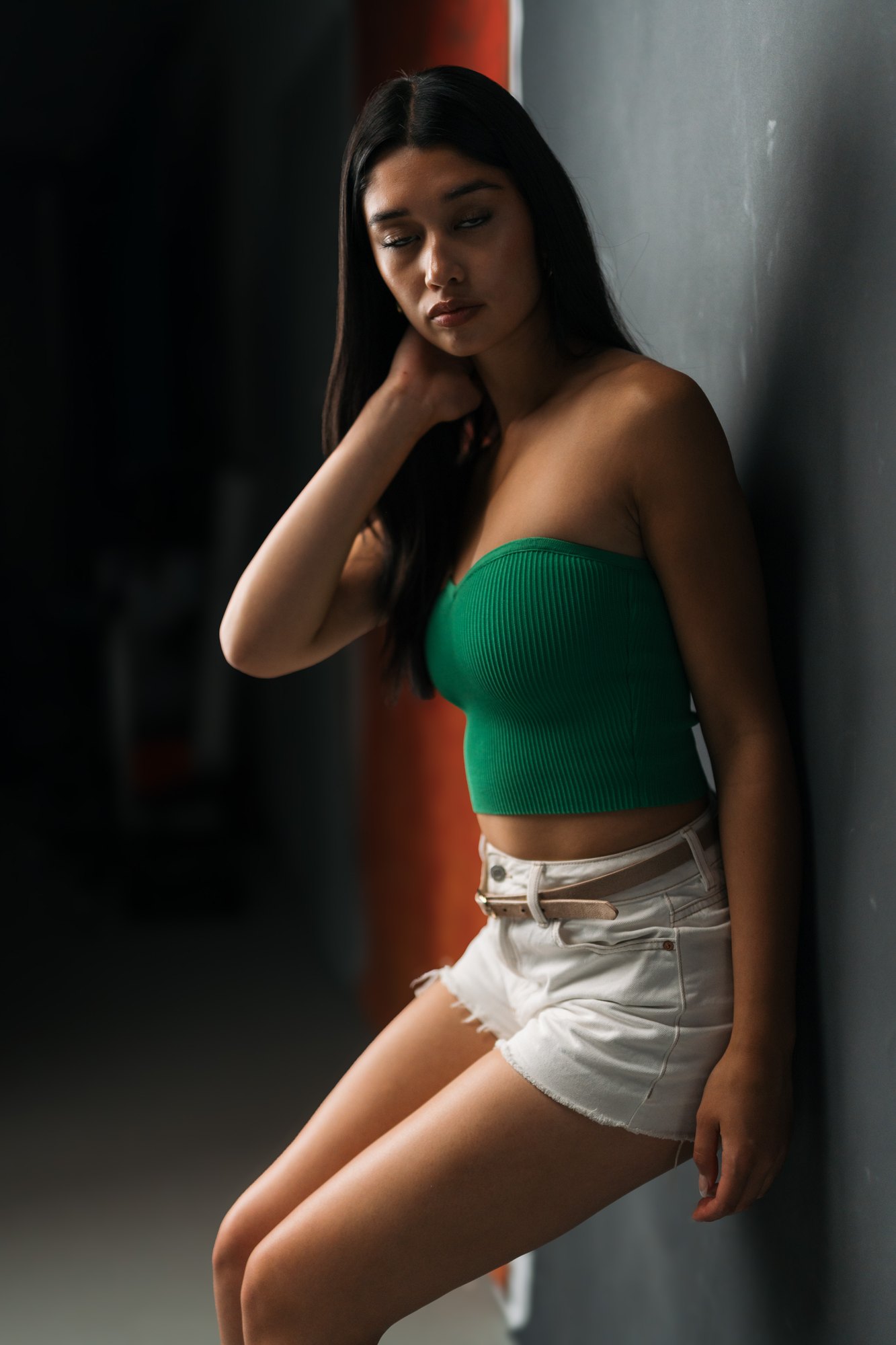 Julia Crofoot — leaning beside the window with one hand in her hair