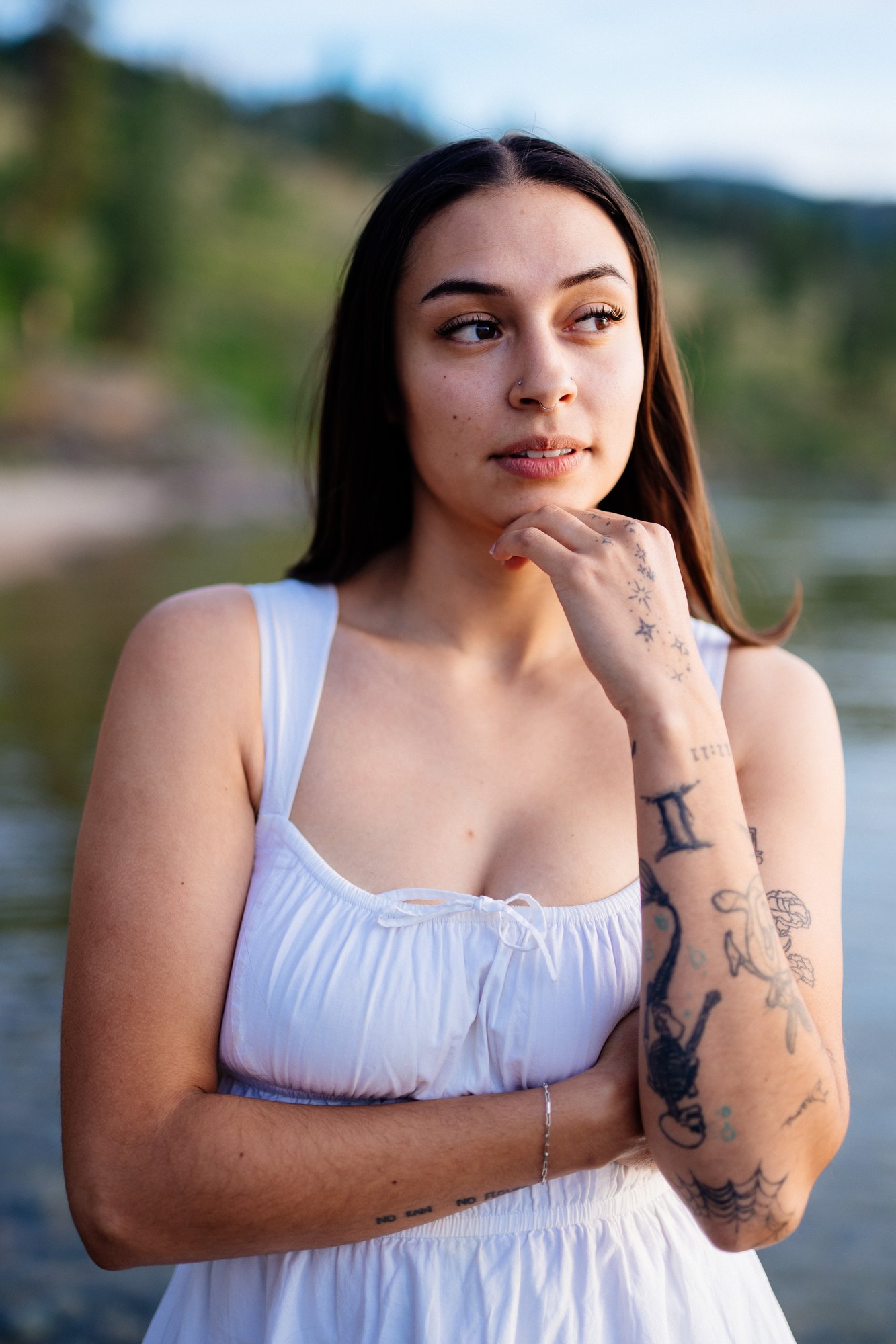 Karly — quiet side portrait with a hand beneath her chin