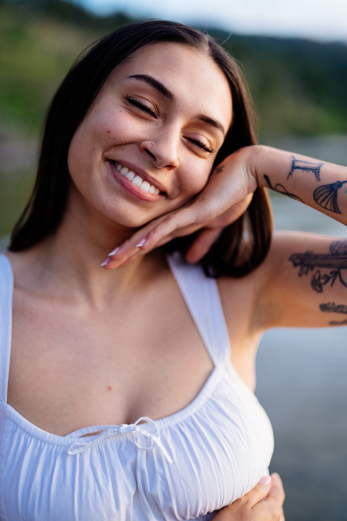 Karly — a candid laugh with her head resting on her hand