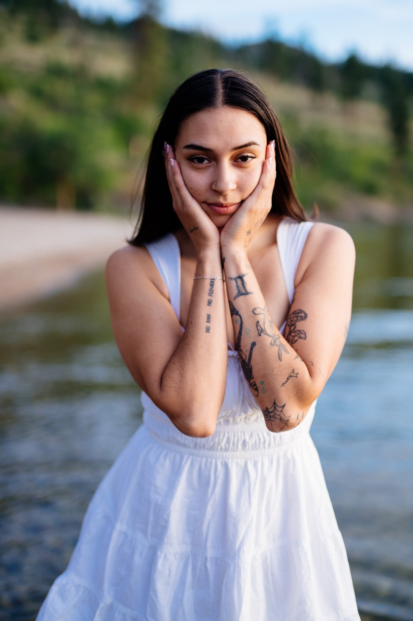 Karly — a playful portrait with her hands beside her face