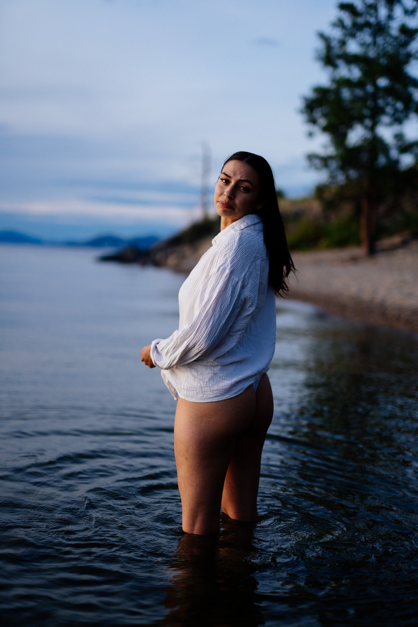 Karly — full-length side portrait beside the water