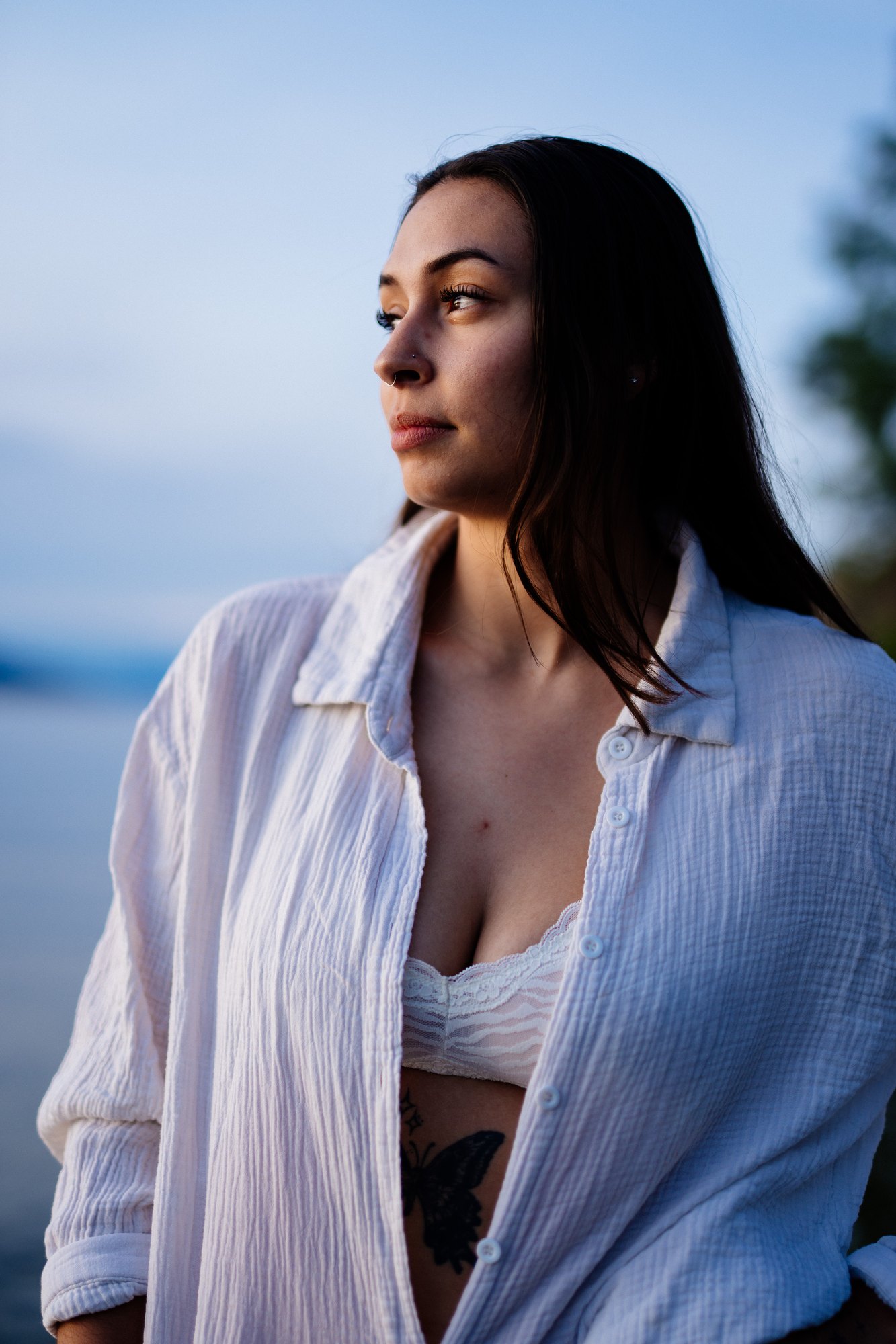 Karly — quiet profile with the evening lake behind her