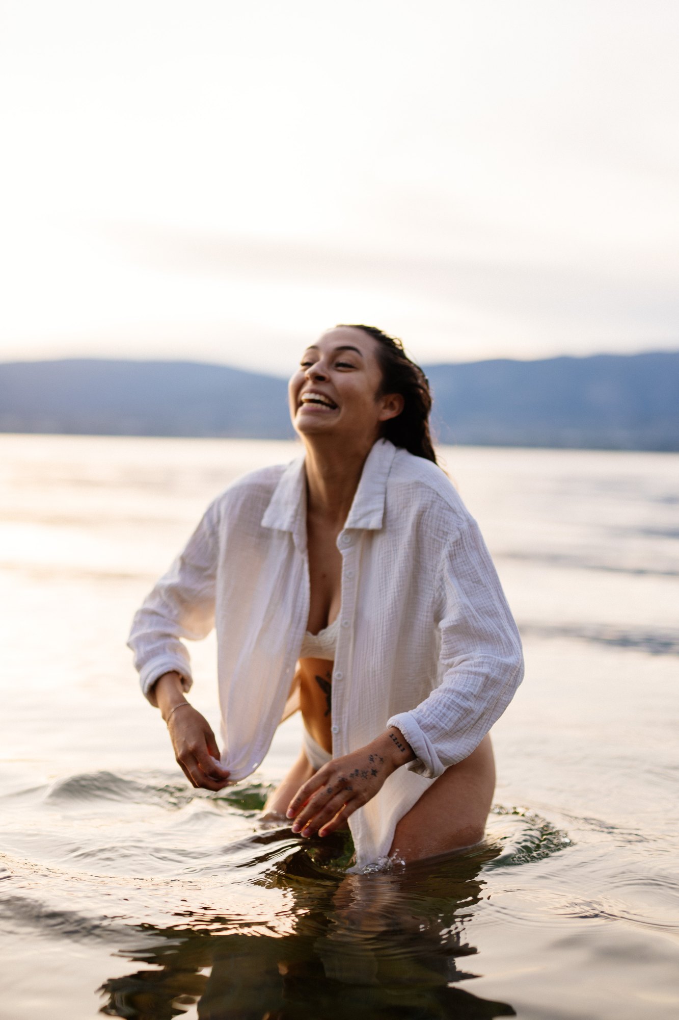 Karly — laughing in the water before a hair flip
