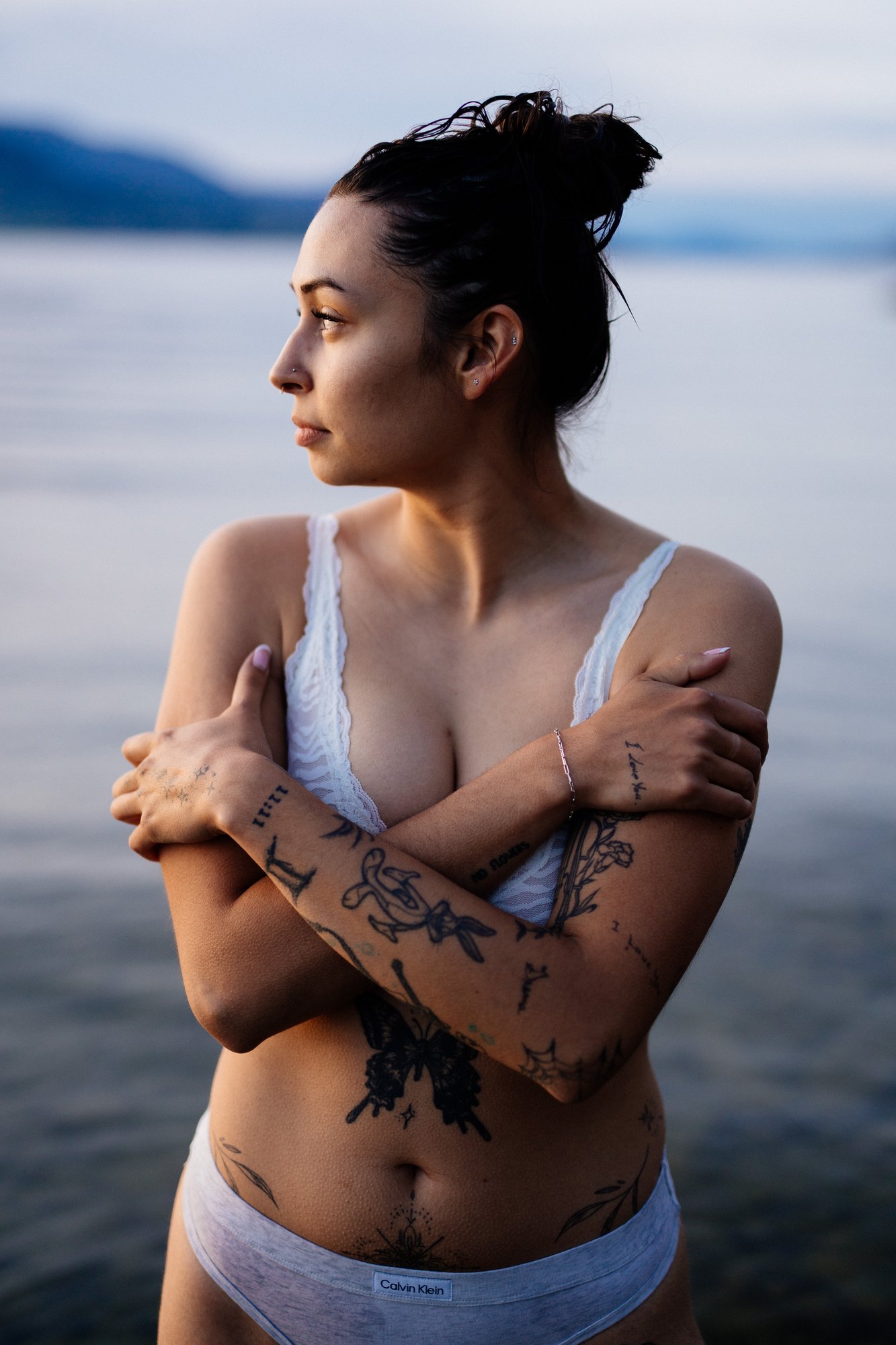 Karly — side portrait with her arms wrapped around herself