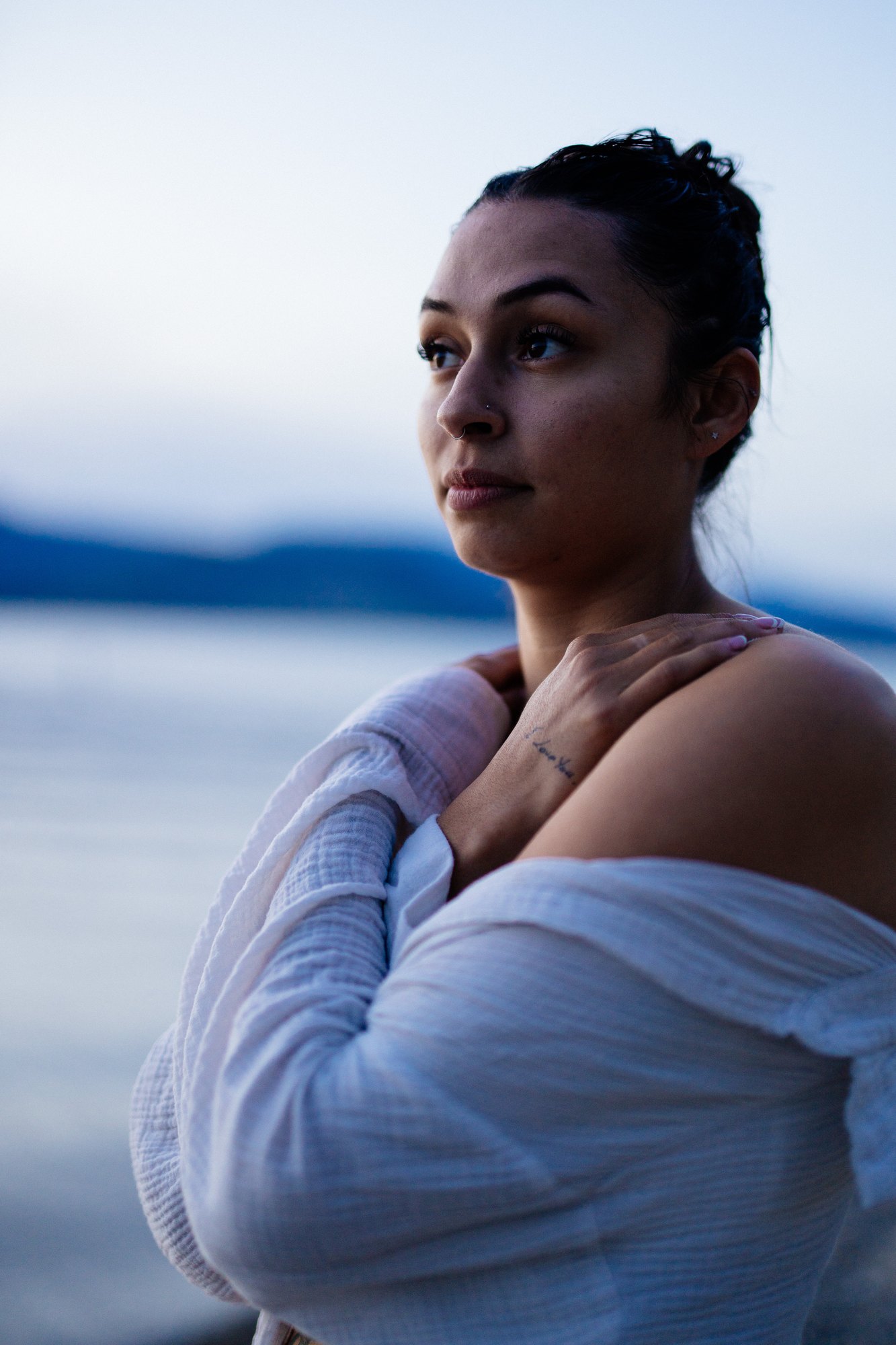 Karly — looking upward beside the evening lake