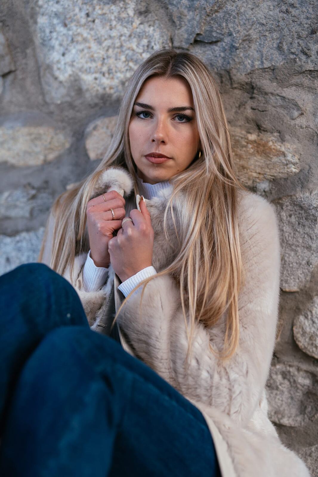 Kaylee at Lier House portraits story frame 10: Penticton portraits for Kaylee at Lier House, moving from window light and interior texture into stone steps, pale winter colour and quiet exterior portrait range.