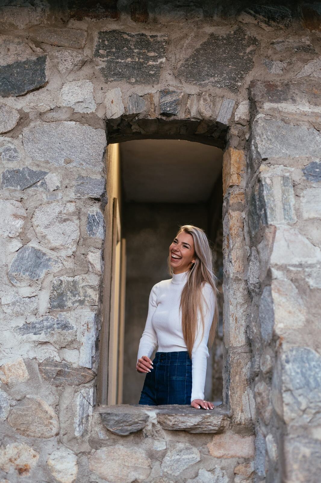Kaylee at Lier House portraits story frame 20: Penticton portraits for Kaylee at Lier House, moving from window light and interior texture into stone steps, pale winter colour and quiet exterior portrait range.