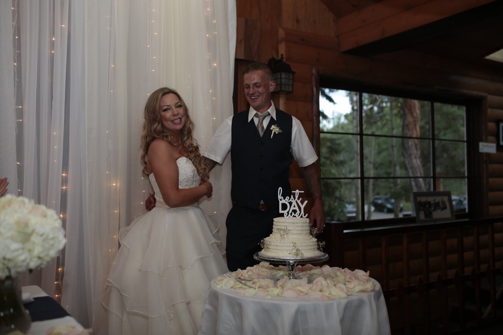 Kendra and Mike story frame 1: An older wedding story with lake dusk, warm room light, speeches, dancing and a full-day feeling.