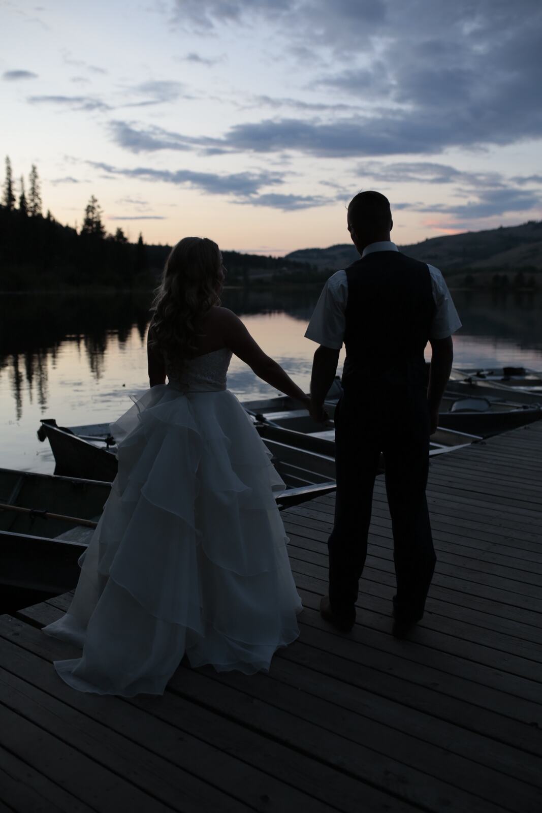 Kendra and Mike story frame 3: An older wedding story with lake dusk, warm room light, speeches, dancing and a full-day feeling.