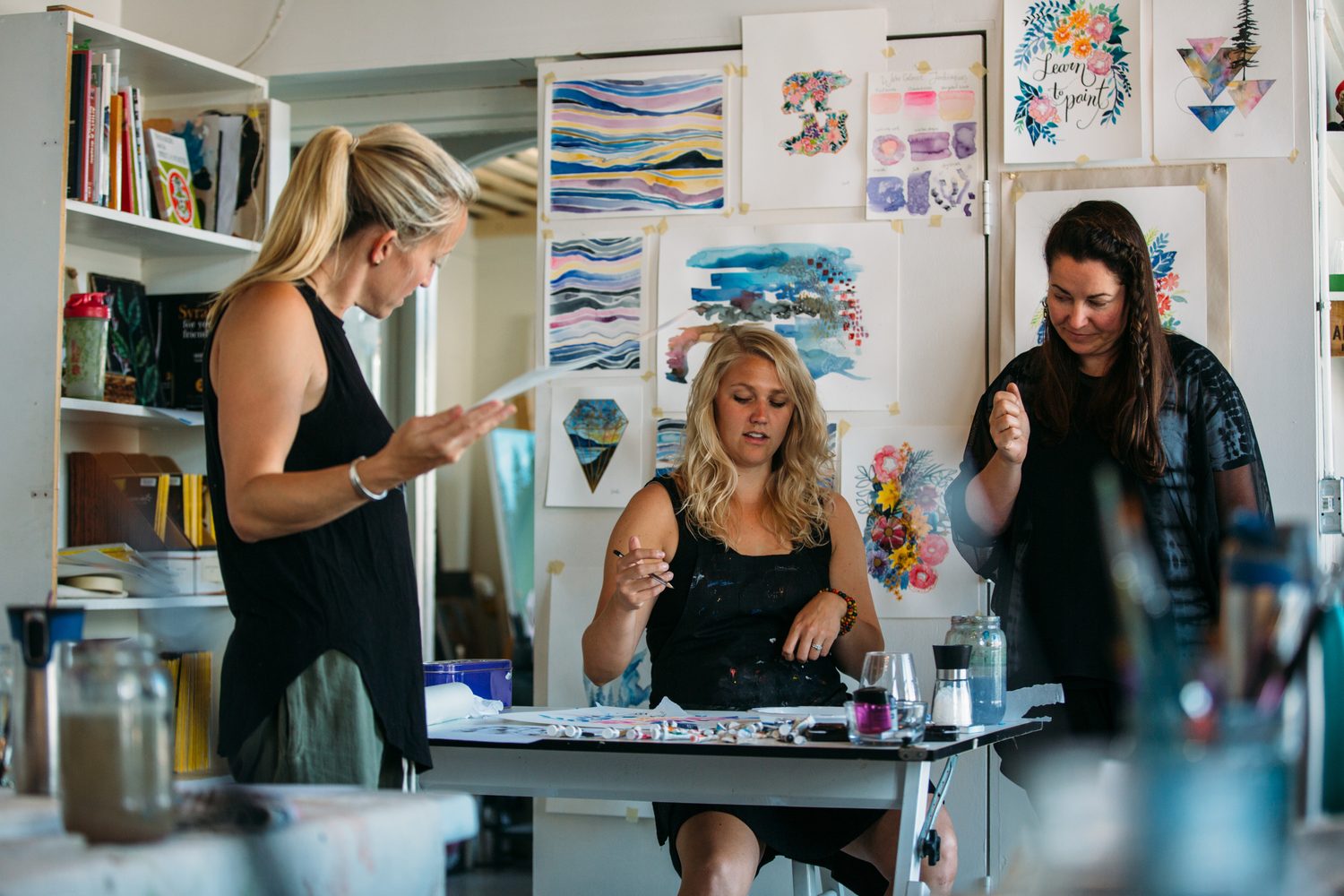 Finished floral watercolour painting taped to the table.