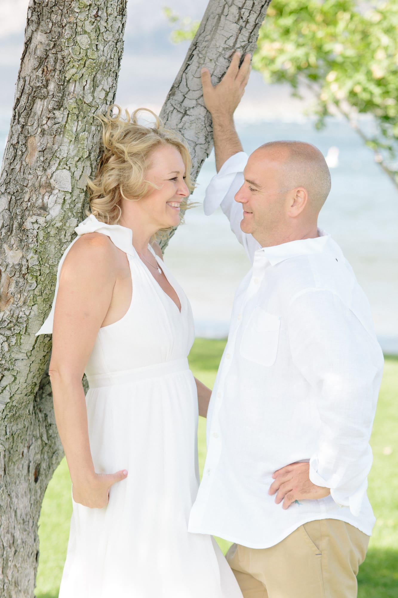 Leeanne and Kelly weddings story frame 9: A Watermark Beach Resort wedding in Osoyoos, built around lakefront context, grown-family connection and careful, big-hearted coverage..