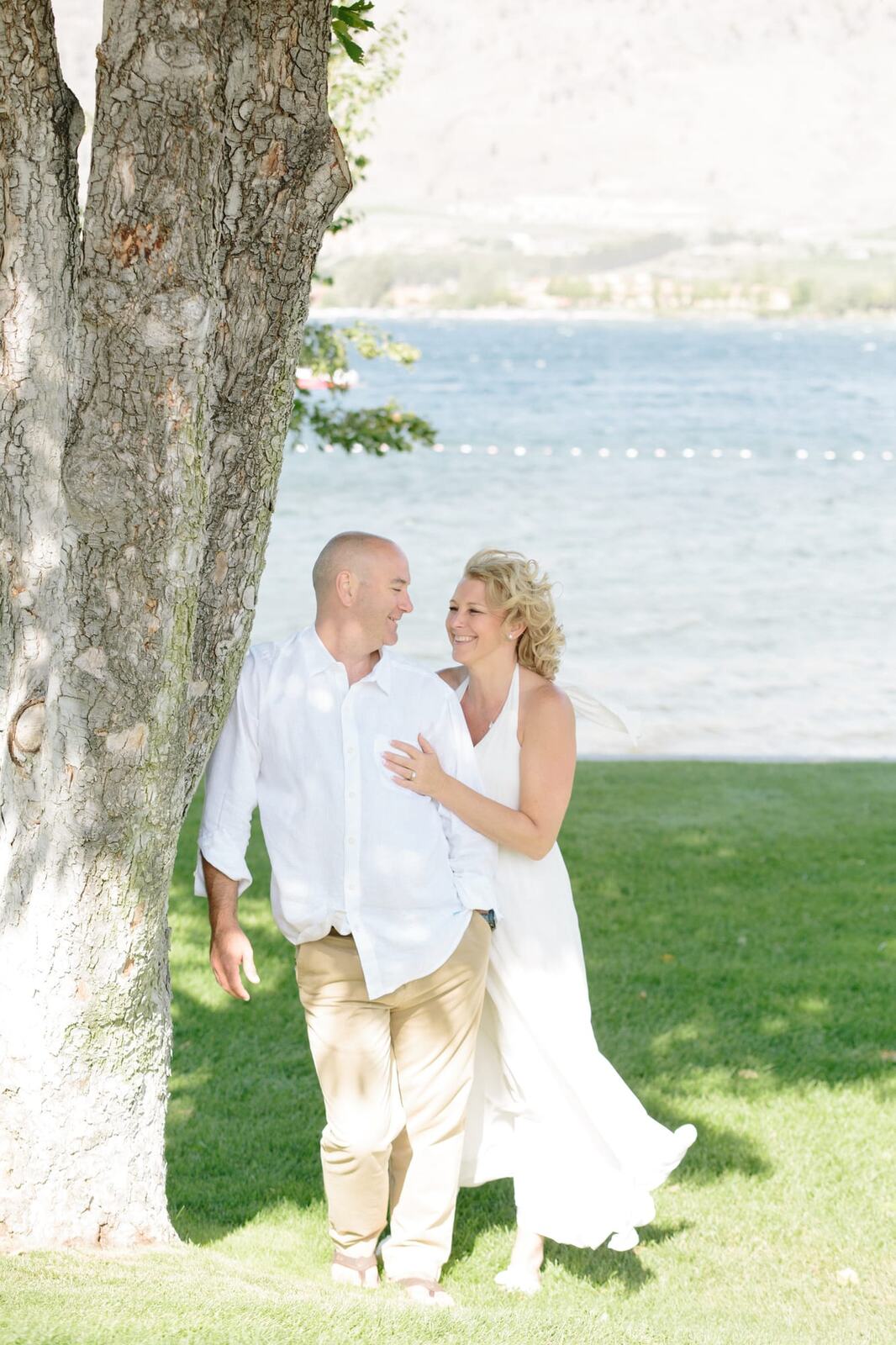 Leeanne and Kelly weddings story frame 8: A Watermark Beach Resort wedding in Osoyoos, built around lakefront context, grown-family connection and careful, big-hearted coverage..