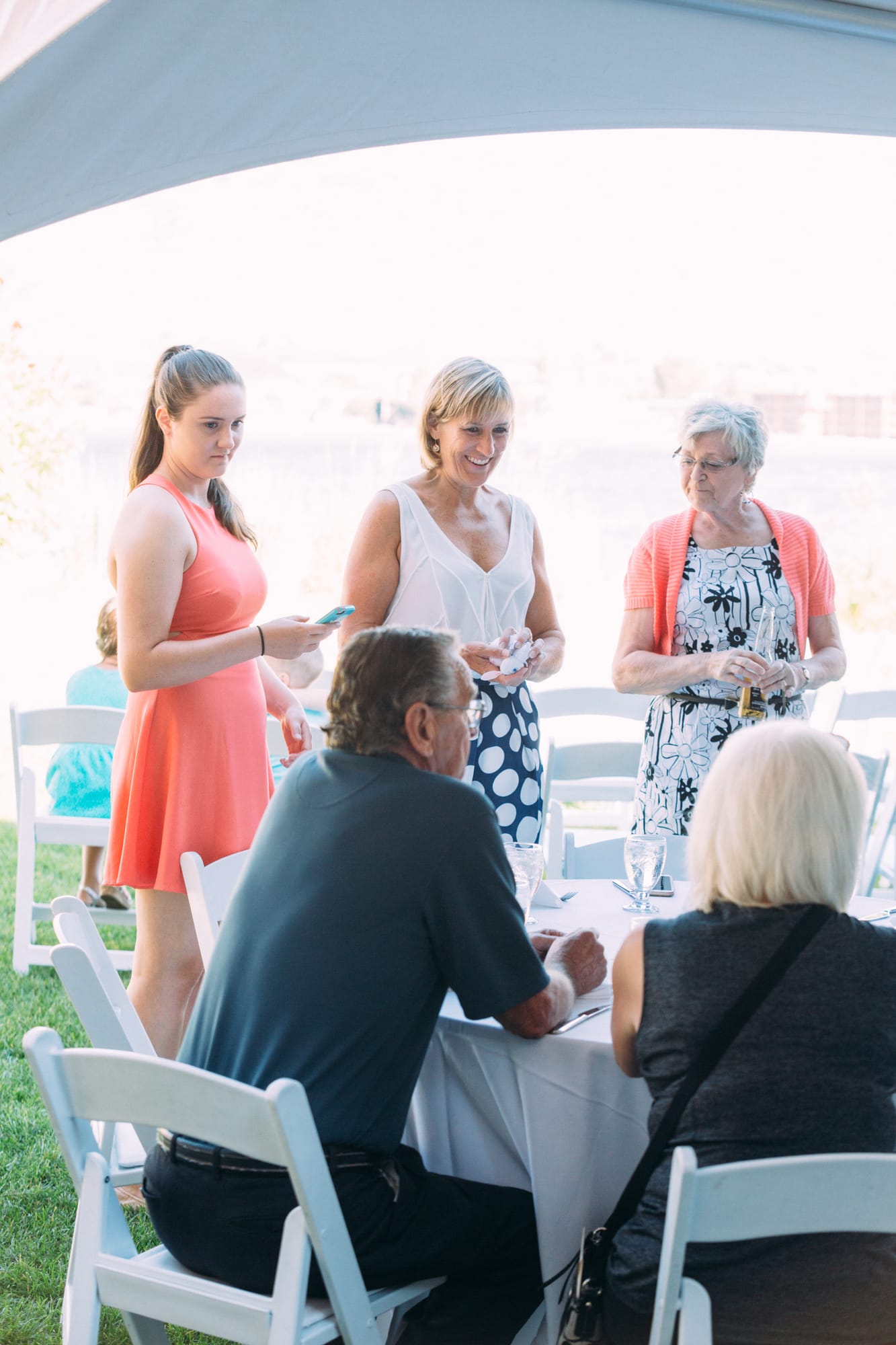 Leeanne and Kelly weddings story frame 13: A Watermark Beach Resort wedding in Osoyoos, built around lakefront context, grown-family connection and careful, big-hearted coverage..