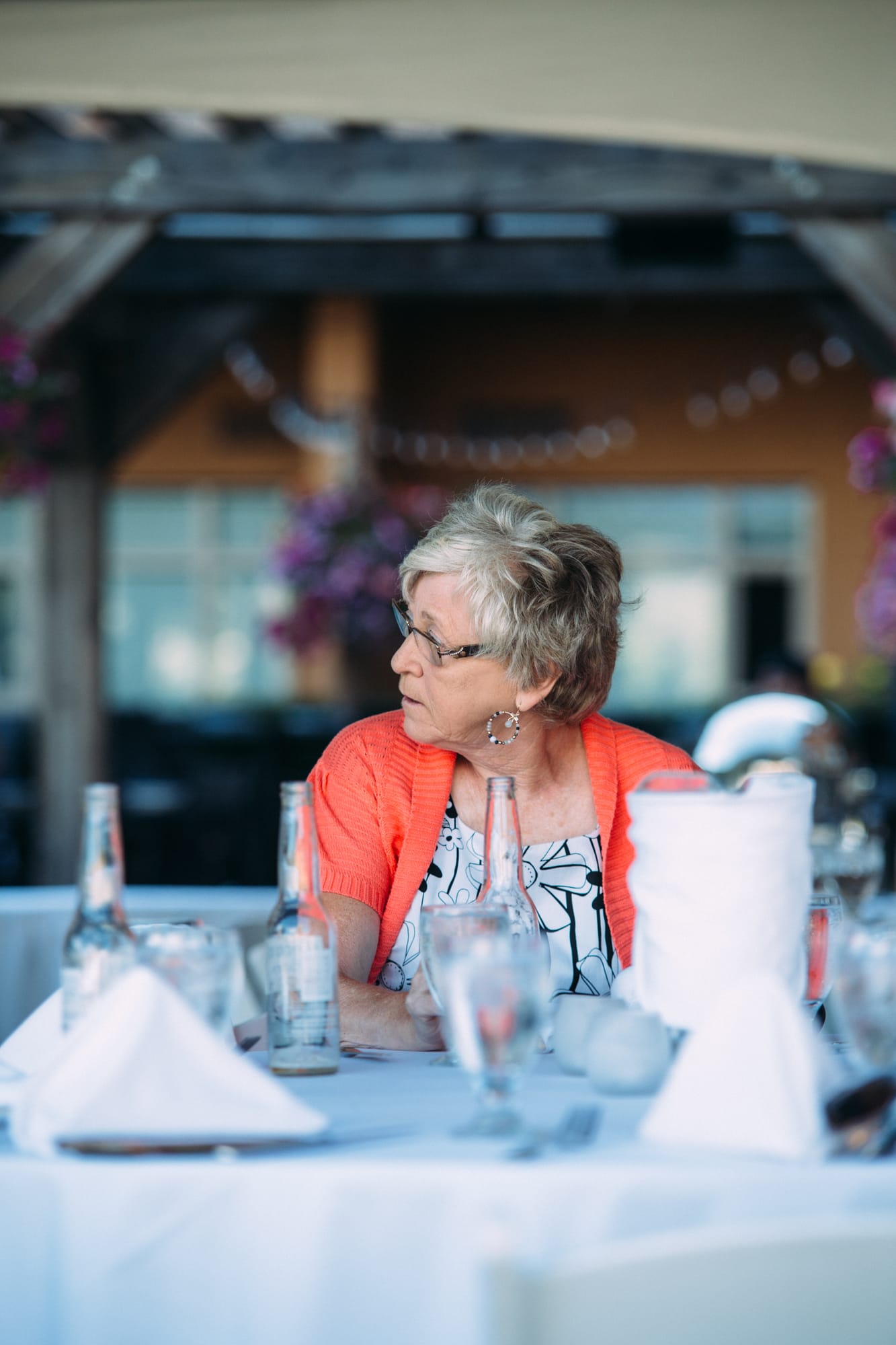 Leeanne and Kelly weddings story frame 15: A Watermark Beach Resort wedding in Osoyoos, built around lakefront context, grown-family connection and careful, big-hearted coverage..